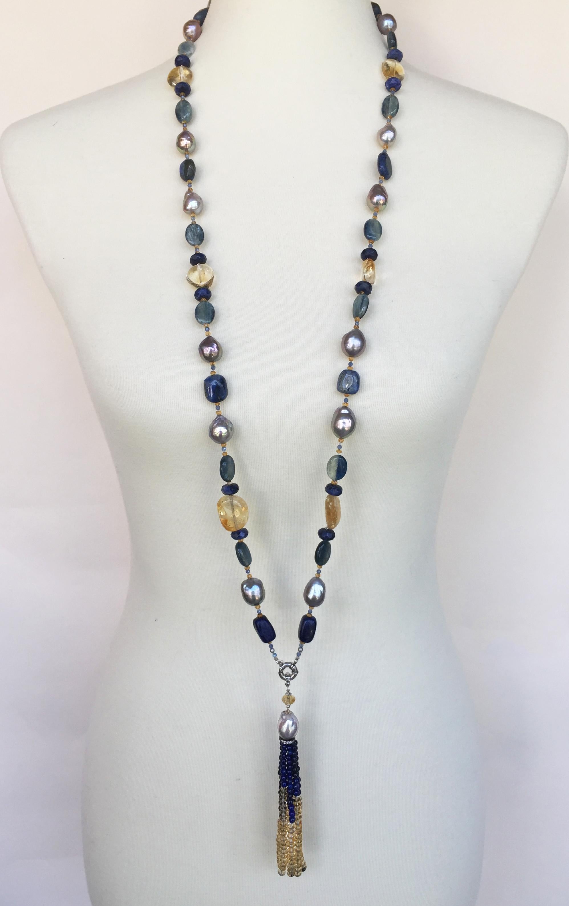 This grey pearl, blue, and yellow semi-precious stone beaded necklace with 14k white gold is a stunning piece by Marina J.. Composed of iridescent grey pearls, lapis lazuli, citrine, labradorite, and blue agate beads this sautoir necklace has a