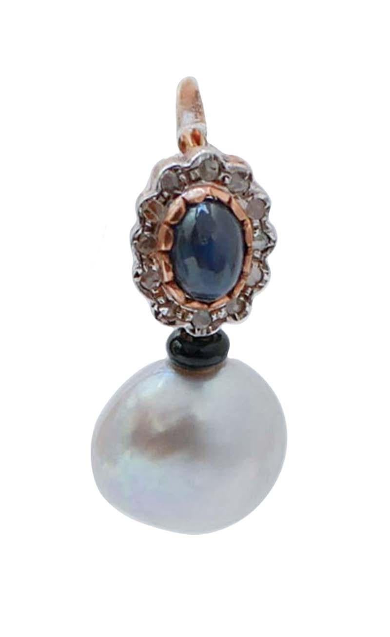 Bellissimi orecchini in oro rosa 9 kt e struttura in argento montata con uno zaffiro centrale circondato da una cornice di diamanti e, sotto, un'onice con una perla grigia.
Diamanti 0,48 ct
Zaffiri 4.42 ct
Onice 0.15 gr
Perle 5.10 gr
Peso totale