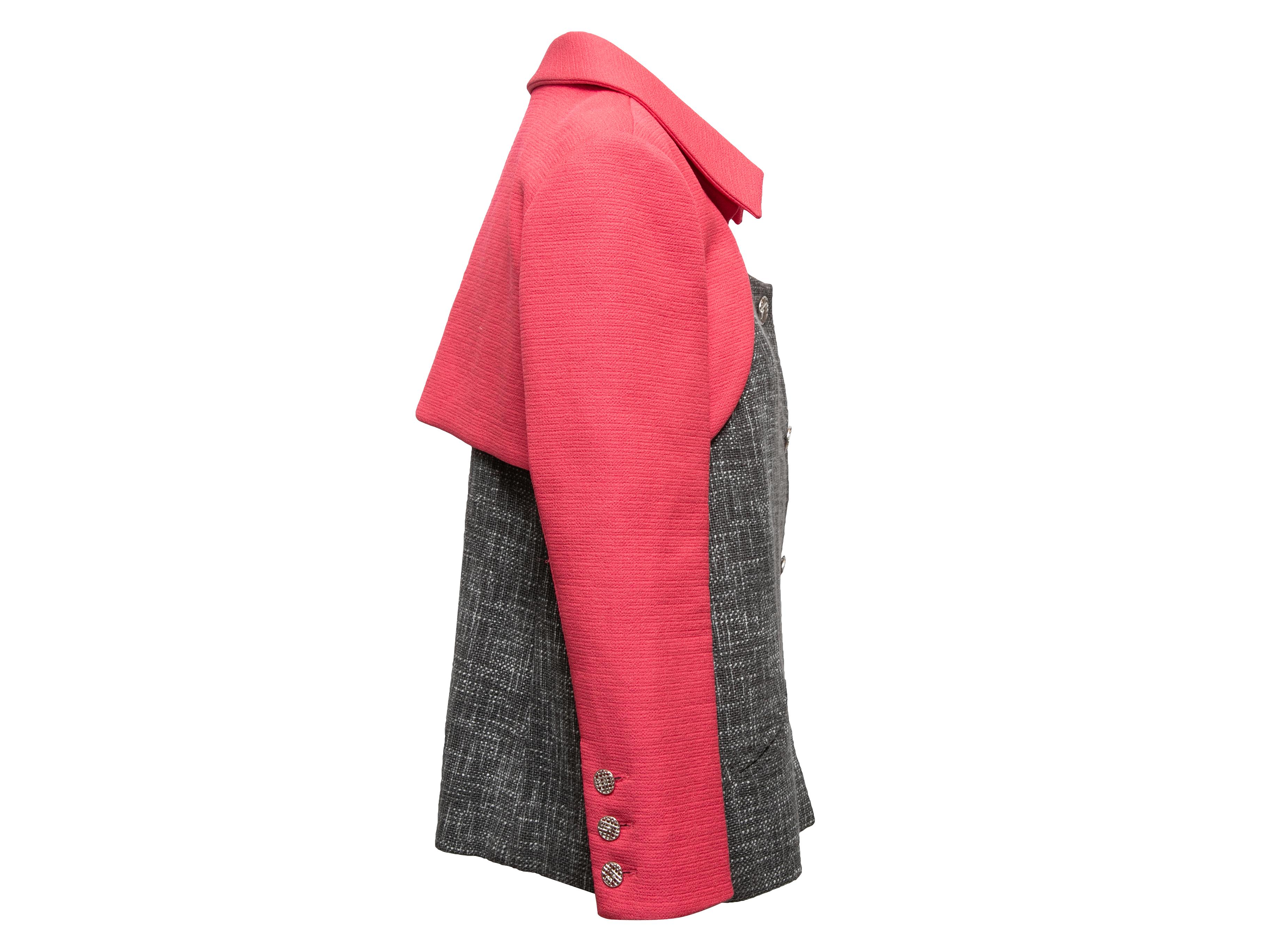 Grey and pink color block blazer by Chanel. Pointed collar. Scoop neck. Dual hip pockets. Button closures at center front. 38