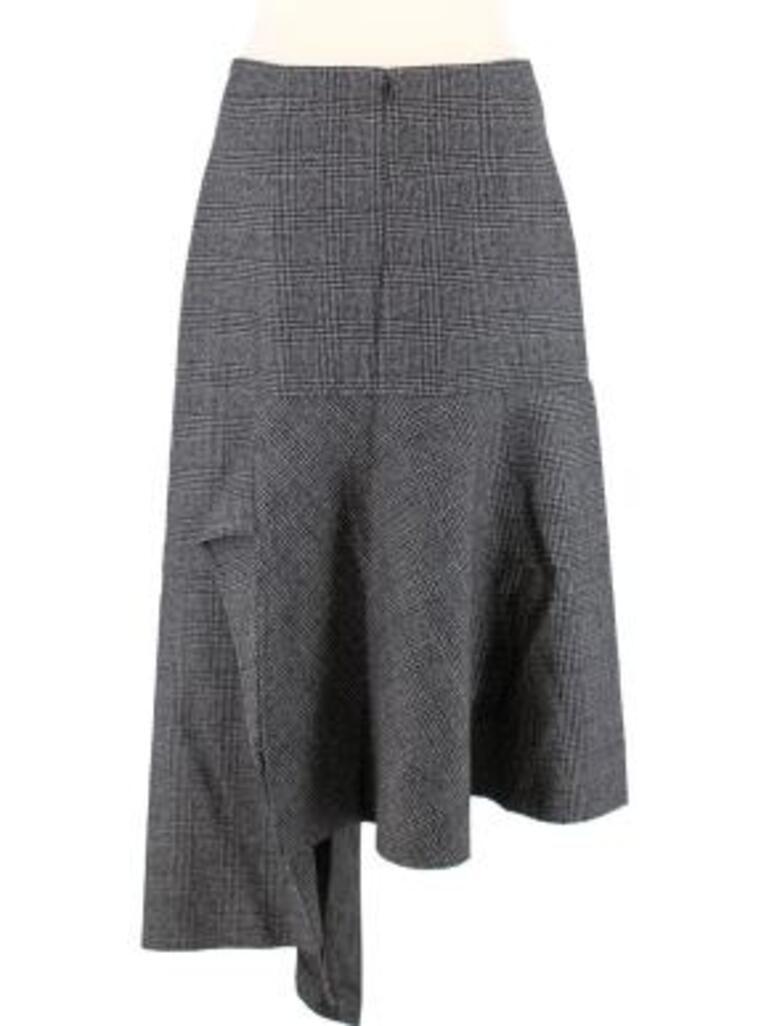 Balenciaga grey Prince of Wales check wool asymmetric skirt
 

 - Prince of Wales check wool cloth
 - A-line shape with draped inset creating an asymmetric effect
 - Zip fastening
 - Lined 
 

 Made in Italy
 Dry clean only
 Outer: 100% virgin wool
