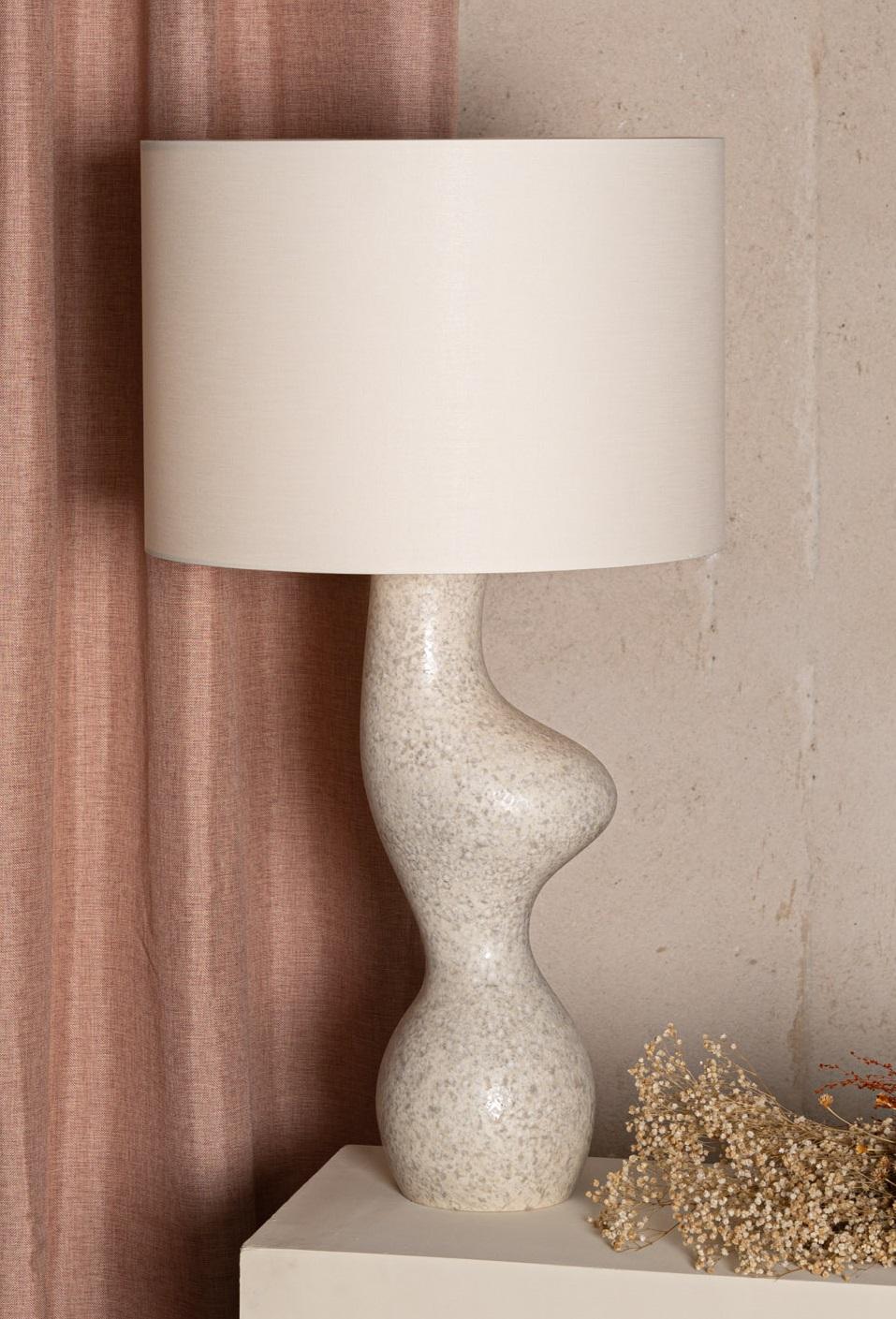 Grey Reactive Ceramic Venuso Table Lamp by Simone & Marcel
Dimensions: Ø 50 x H 78 cm.
Materials: Cotton and ceramic.

Also available in different ceramic options. Custom options available on request. Please contact us. 

All our lamps can be wired