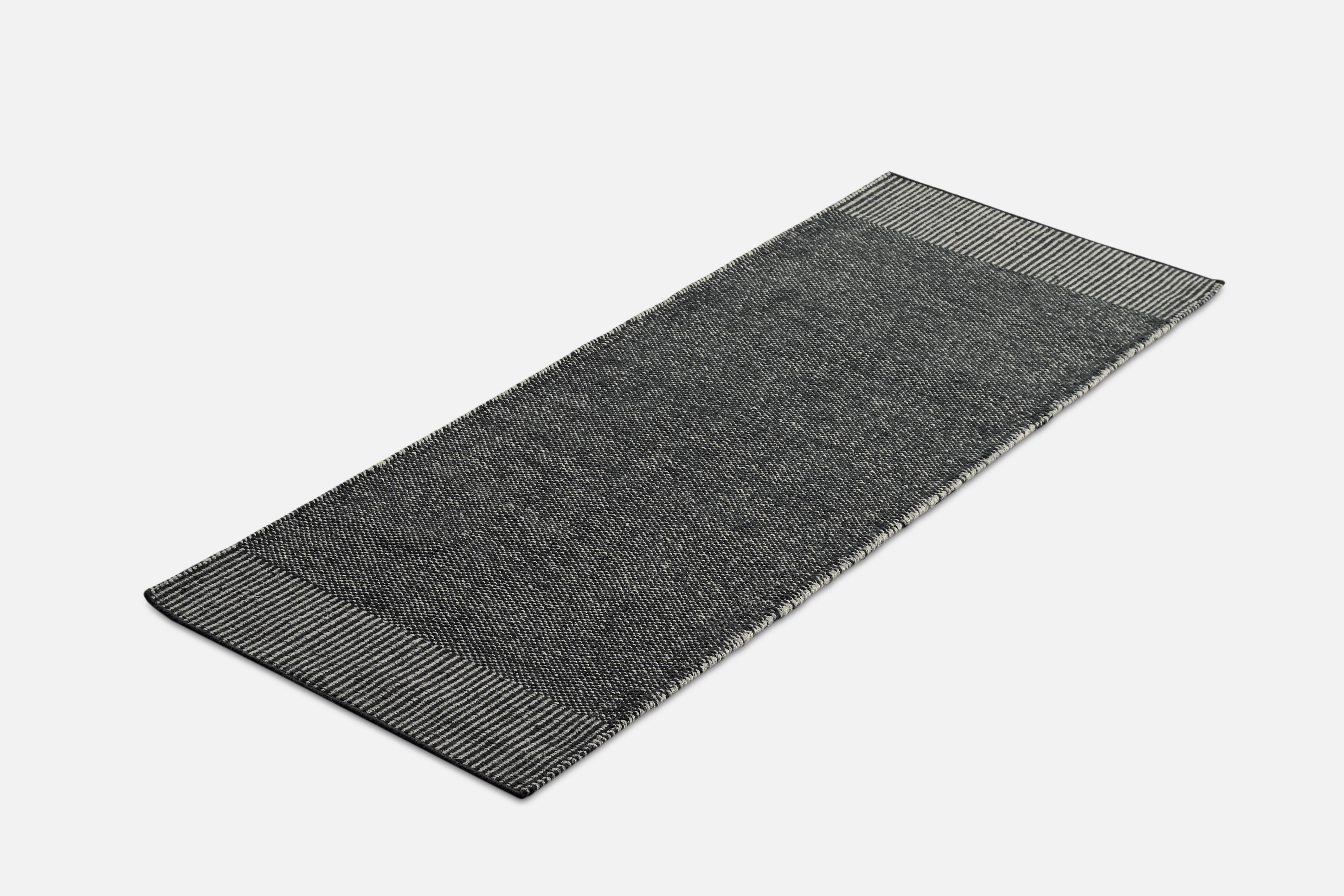 Grey Rombo runner rug by Studio MLR
Materials: 65% wool, 35% jute.
Dimensions: W 75 x L 200 cm
Available in 3 sizes: W90 x L140, W170 x L240, W75 x L200 cm.
Available in grey, moss green and rust.

Rombo is characterised by the materials used
