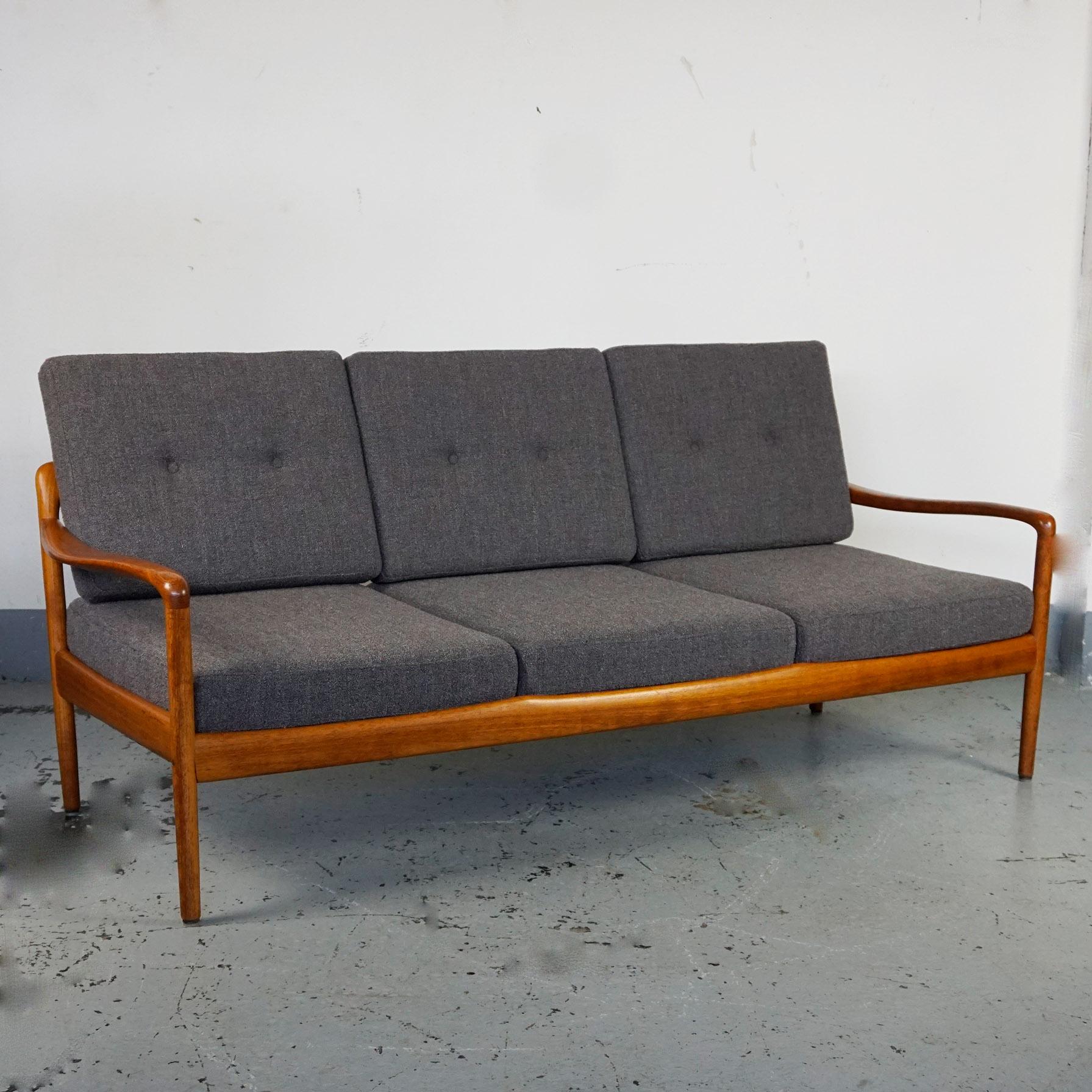 Organic 1960s teak 3-seat sofa in very good condition with new Kvadrat fabric upholsterd cushions by Knoll Antimott, Germany 1960s, Mid-Century Modern design. The legendary 