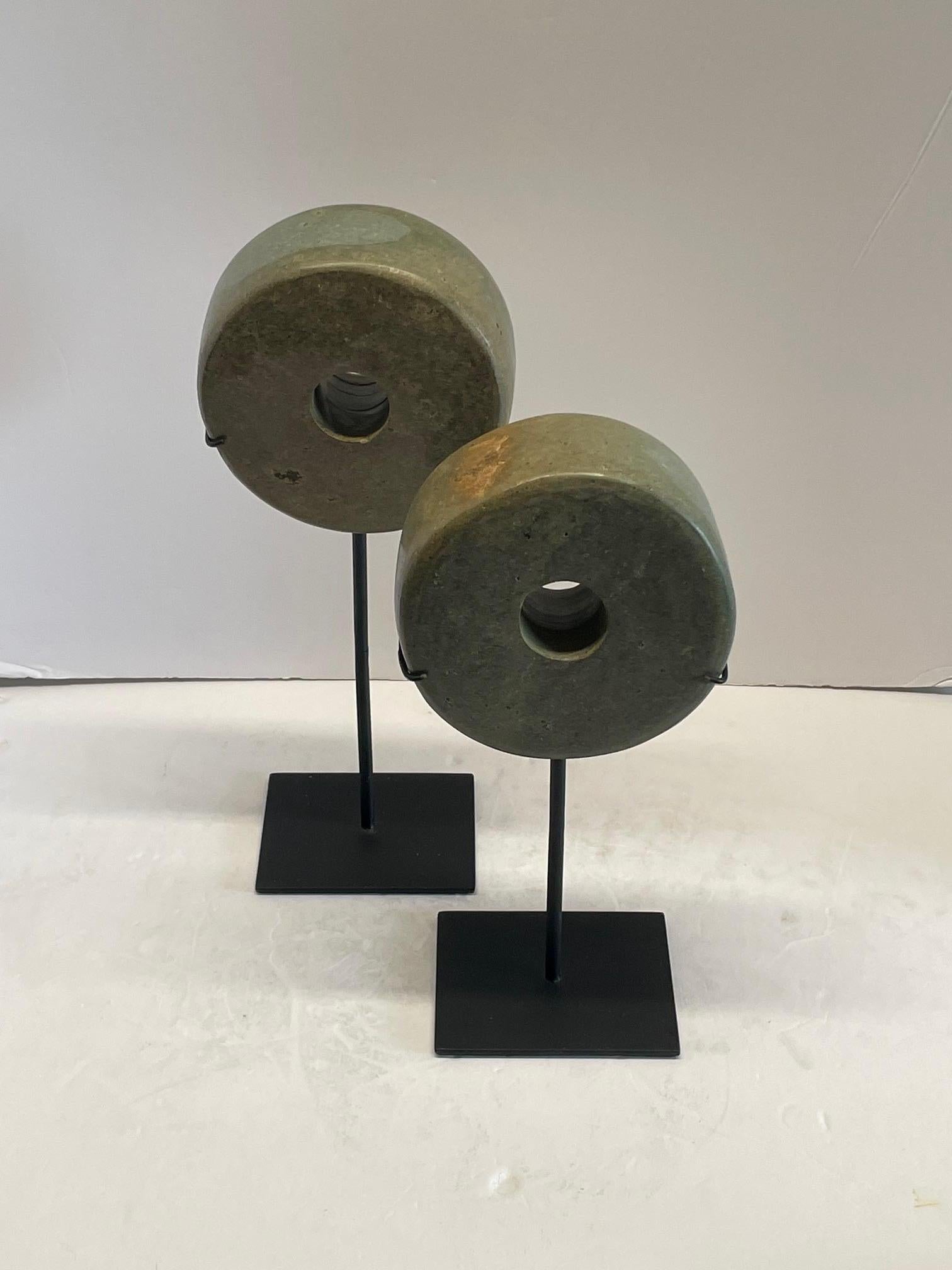 Contemporary Chinese set of two thick stone discs on stands.
Polished finish.
One measures 6