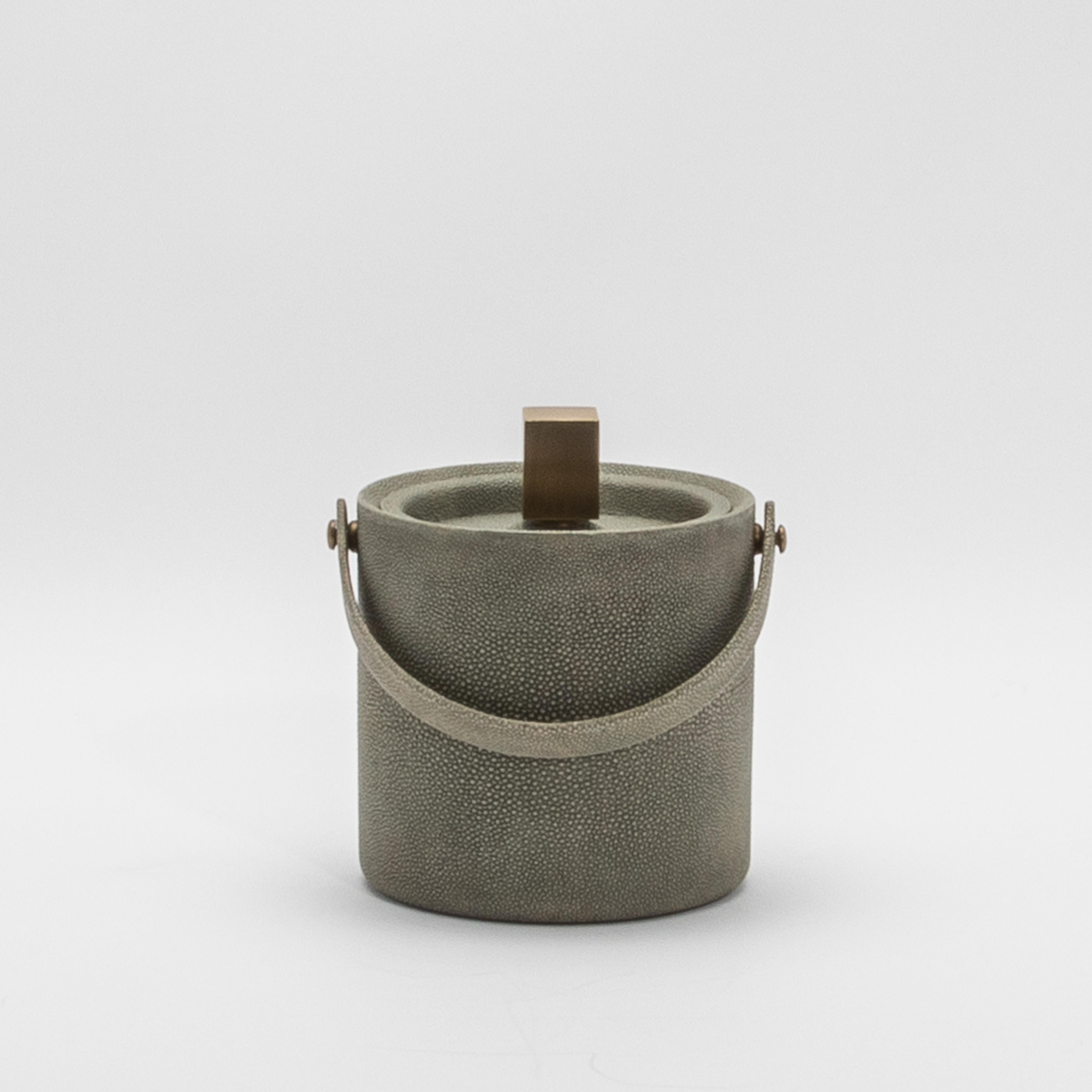 Elevate your barware collection with this exquisitely handcrafted Grey Shagreen Ice Bucket by KIFU Paris, a stunning marriage of luxury and functionality. The soft grey shagreen exterior, known for its subtly textured finish, exudes sophistication,