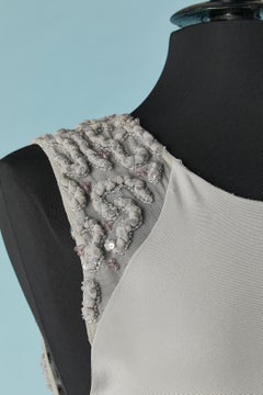 Grey sleeveless evening dress with beaded work on the back and waist