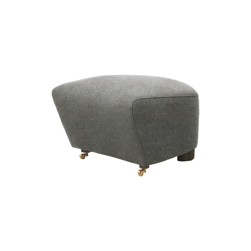 Grey smoked Oak Hallingdal the Tired Man footstool by Lassen
Dimensions: W 55 x D 53 x H 36 cm 
Materials: Textile

Flemming Lassen designed the overstuffed easy chair, The Tired Man, for The Copenhagen Cabinetmakers’ Guild Competition in 1935.