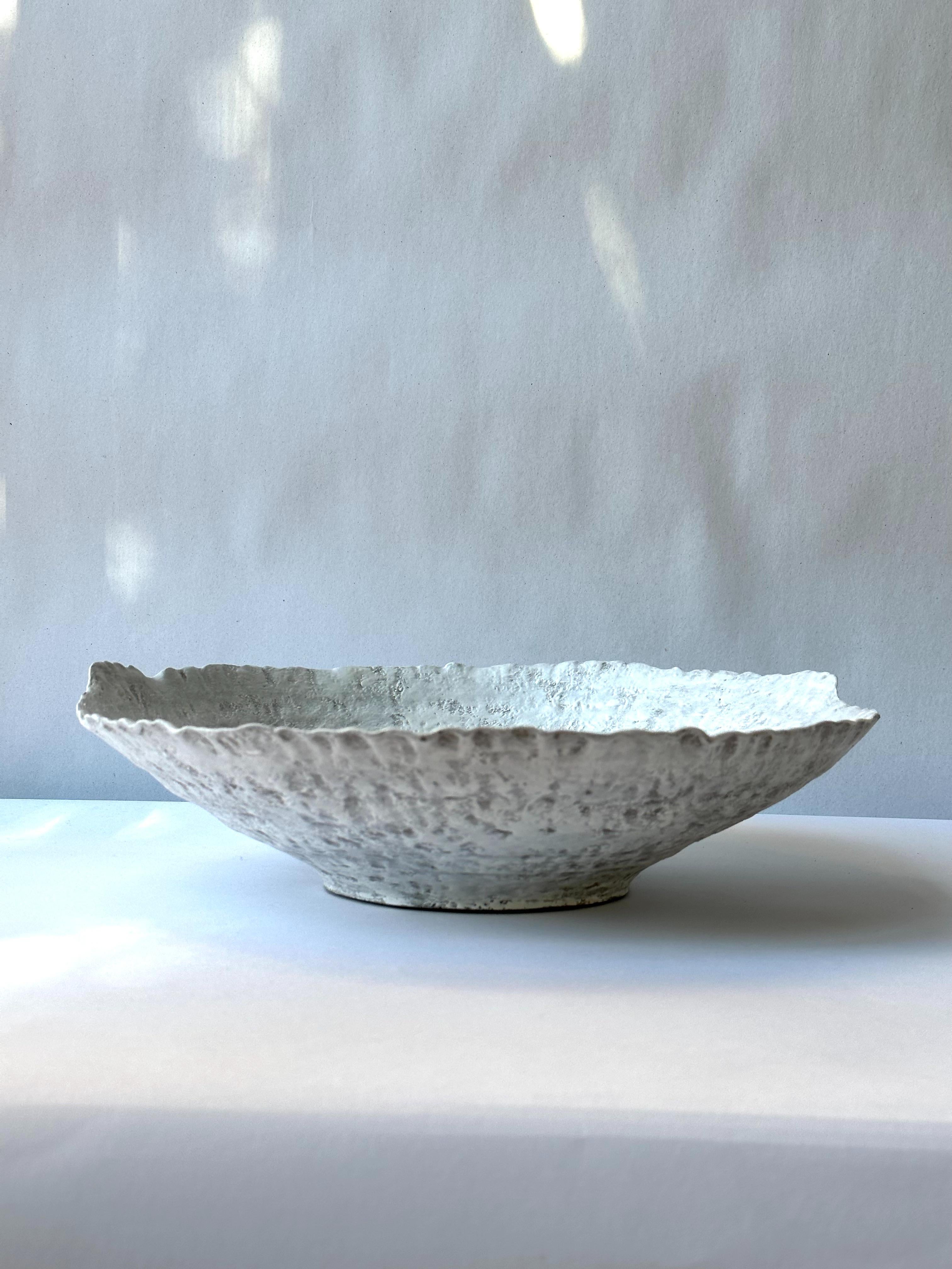 Grey Stoneware Symposio Bowl by Elena Vasilantonaki
Unique
Dimensions: ⌀ 34 x H 10 cm (Dimensions may vary)
Materials: Stoneware
Available finishes: Black, White, Brown, Red, White patina

Growing up in Greece I was surrounded by pottery forms that