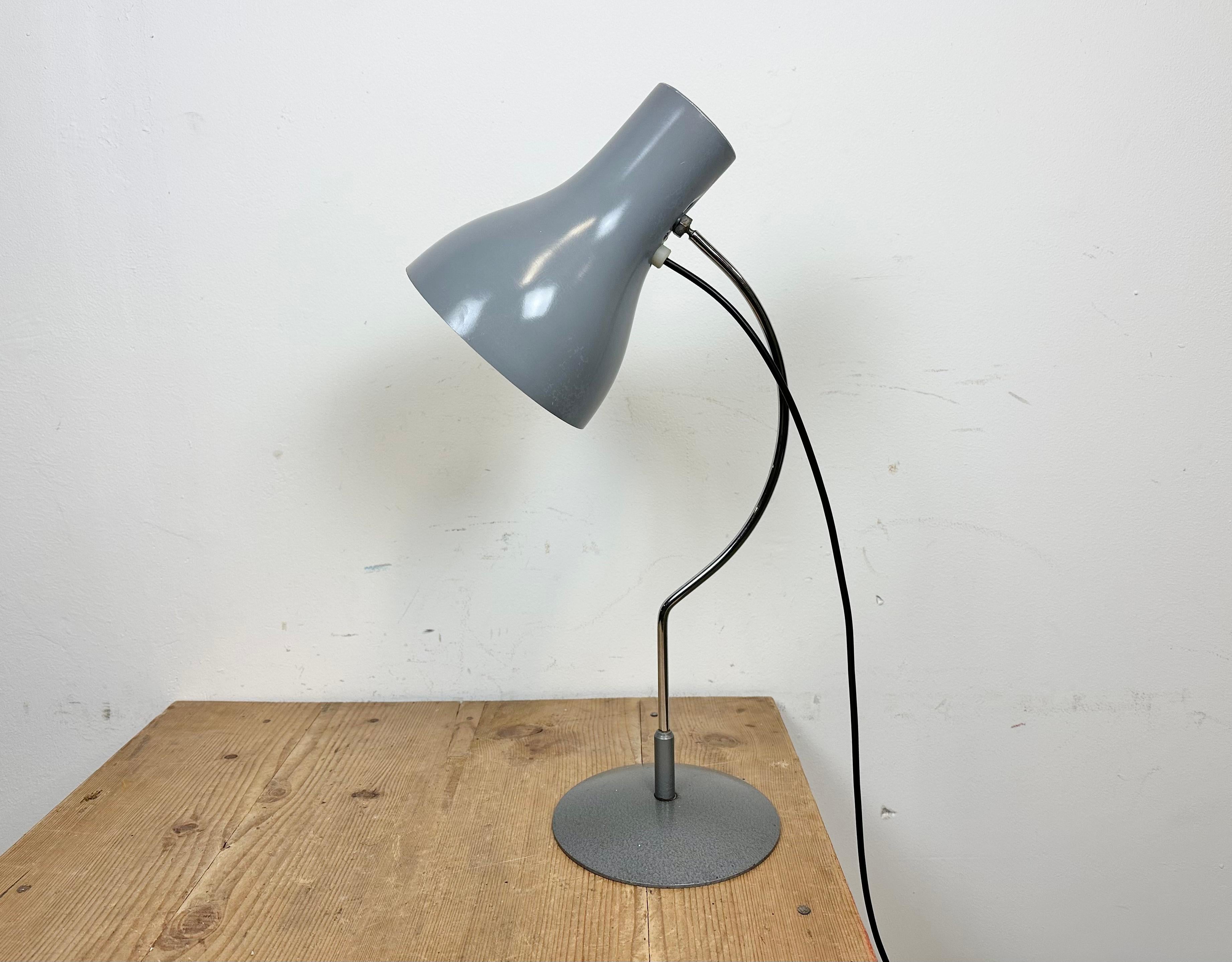 This table lamp, Napako model 0521, was designed by Josef Hurka and produced by Napako in former Czechoslovakia during the 1960s. The lamp has a steel body and an aluminium lampshade.Switch is situated directly on the shade. Good vintage condition.
