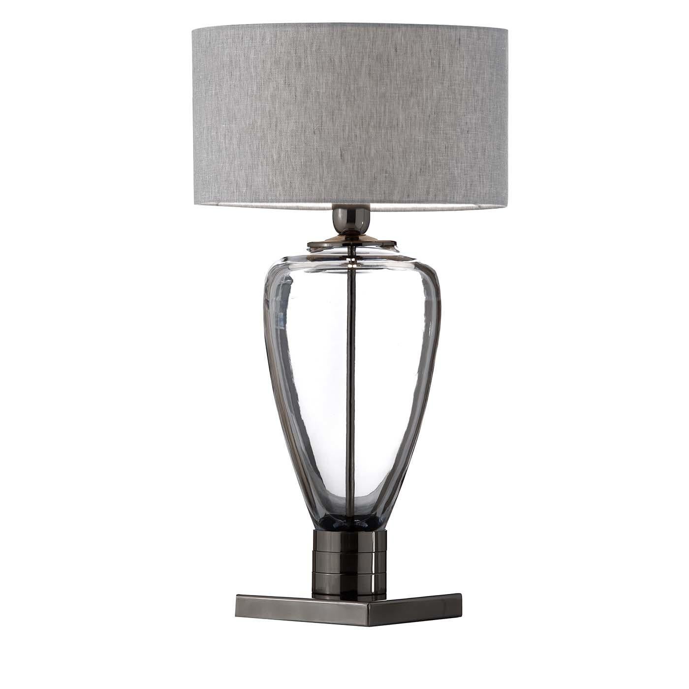 A precious addition to a contemporary decor, this table lamp can be paired alongside an identical one flanking a mirror in an entryway or used to add extra light to a living room or private study. The structure was crafted entirely of 24 lead