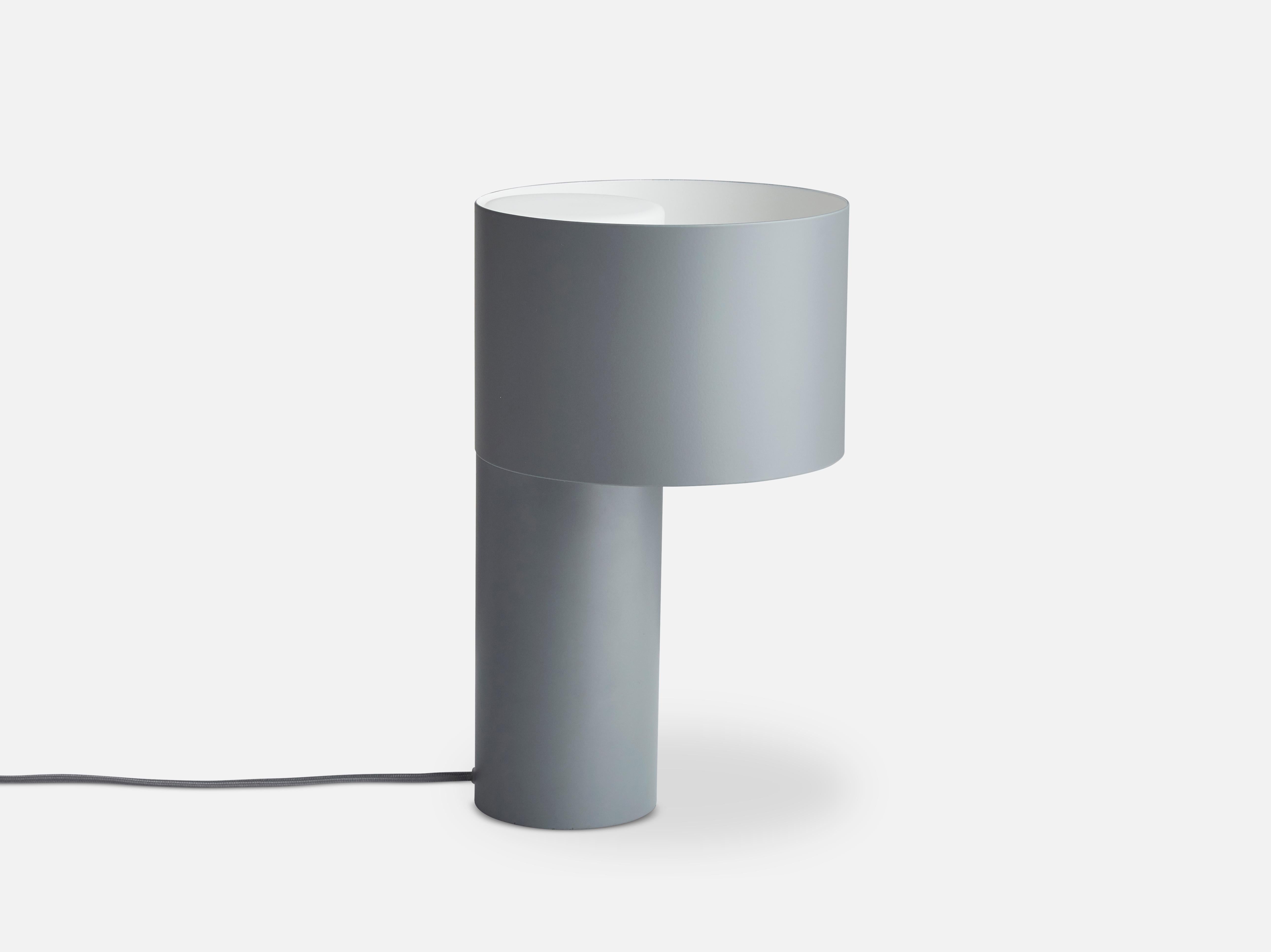 Grey tangent table lamp by Frederik Kurzweg
Materials: Metal, glass.
Dimensions: D 20 x H 34 cm
Available in forest green, desert sand and cool grey.

Frederik Kurzweg is an upcoming design talent born in Germany. His background as a trained