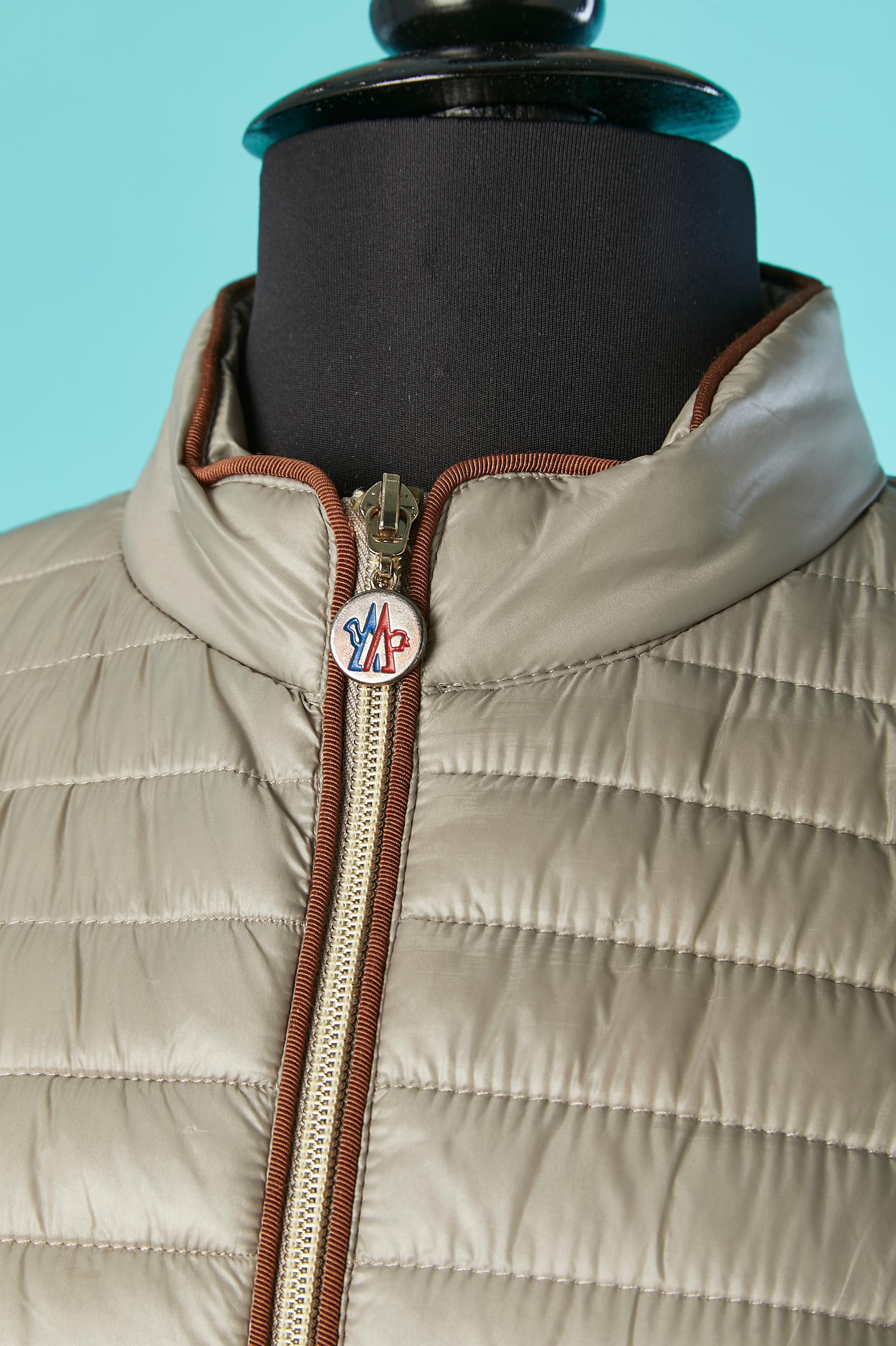 Grey thin down-jacket. Shell and lining: 100% polyester. 
SIZE M 