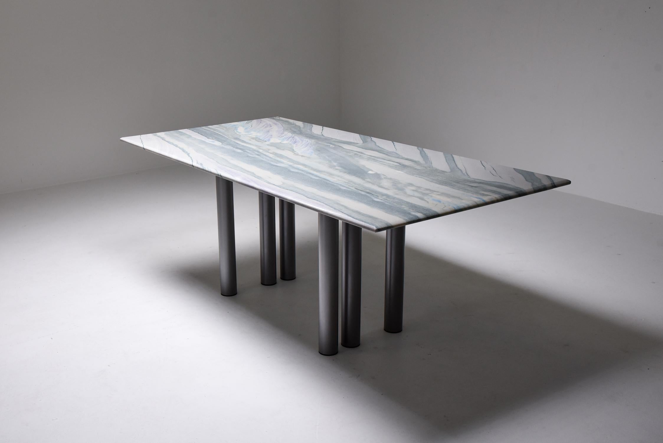 Pia Manu marble dining table, Belgium 1990s

Postmodern dining table from Pia Manu, the marble top displays different shades of gray and some blue to purple.
Grey Lacquered steel base with an asymmetric repetition in the legs.

Pia Manu is a