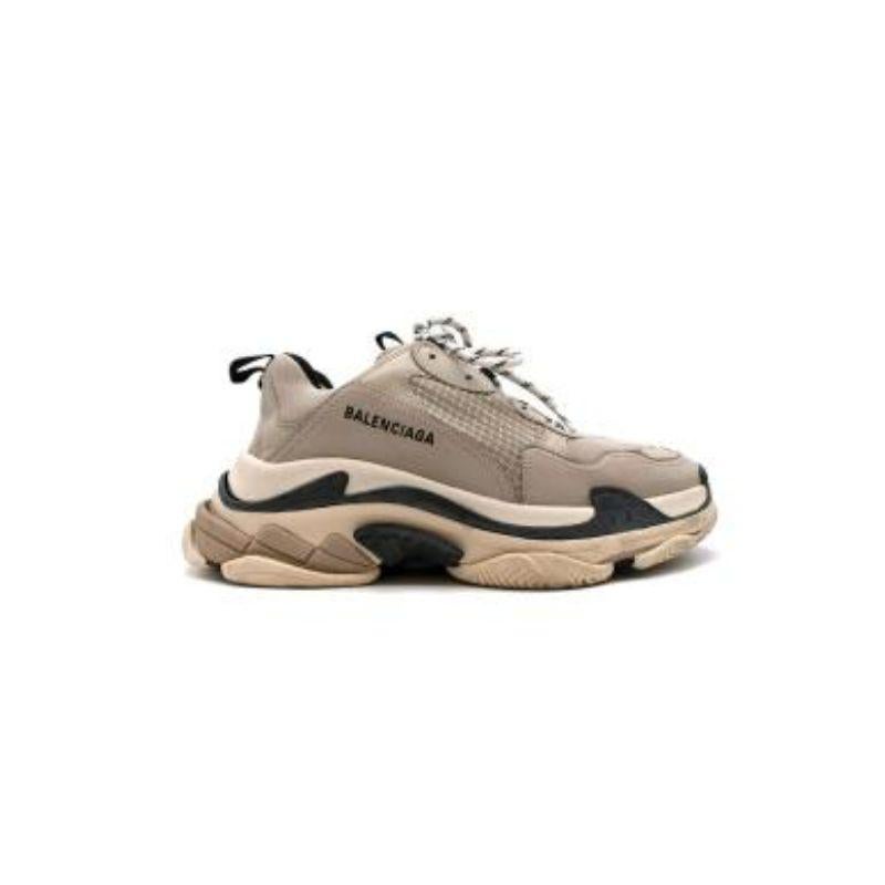 Balenciaga Grey Triple S Sneakers
 
 - Oversized platform sneakers in a grey, beige, white and black colourway
 - 'Double foam' and mesh upper body 
 - Embroidered branding along the outer sides 
 - Thick fabric lace up fronts
 
 Materials 
 48%