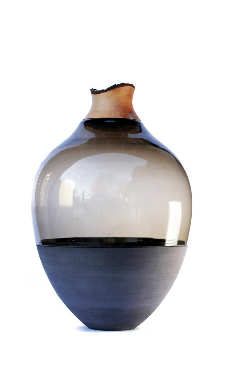 Grey TSV4 stacking vessel, Pia Wüstenberg.
Dimensions: D 34 x H 57.
Materials: glass, wood, ceramic.
Available in other colors.

Handmade in Europe: handblown glass (Czech Republic), ceramic (handmade in Scotland), hand turned wood