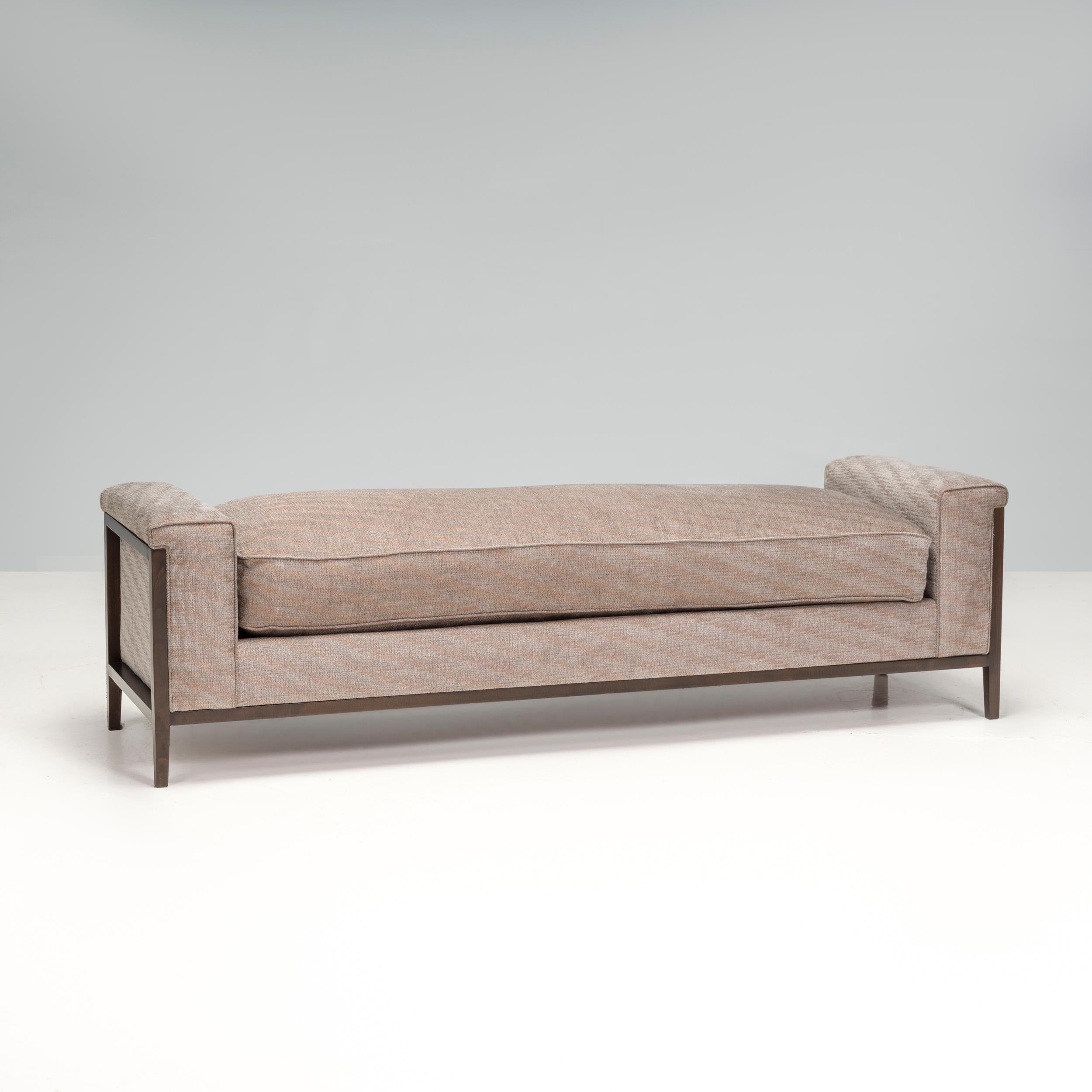 The Grey Upholstered Bench features a streamlined frame that sits elevated above a carved wood framing that is light and modern. This minimalist silhouette gives the piece a sense of refinement. The Grey Upholstered Bench makes a great anchor in the