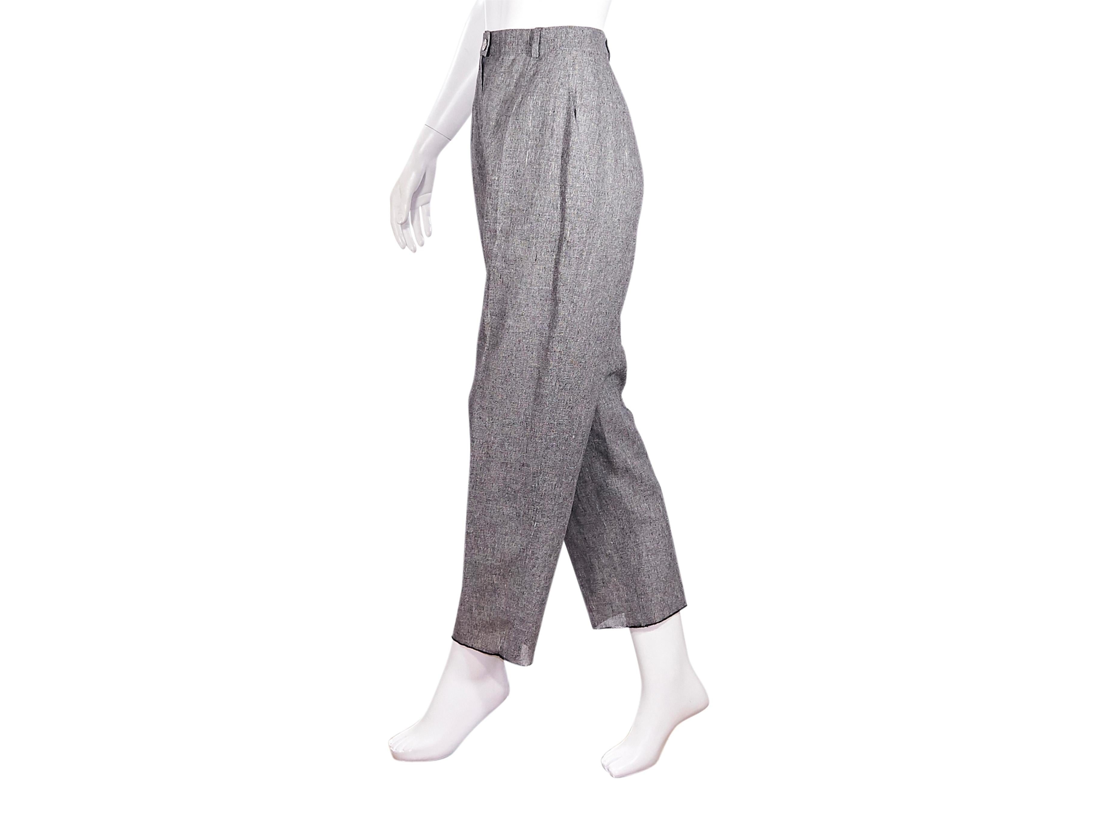 Product details:  Vintage grey linen straight-leg pants by Chanel Boutique. Circa 1998.  High-waist. Looped waist. Button and concealed zip front closure. Dual slit pockets at side. Cropped hems. Pair with black leather kitten heel ankle boots.