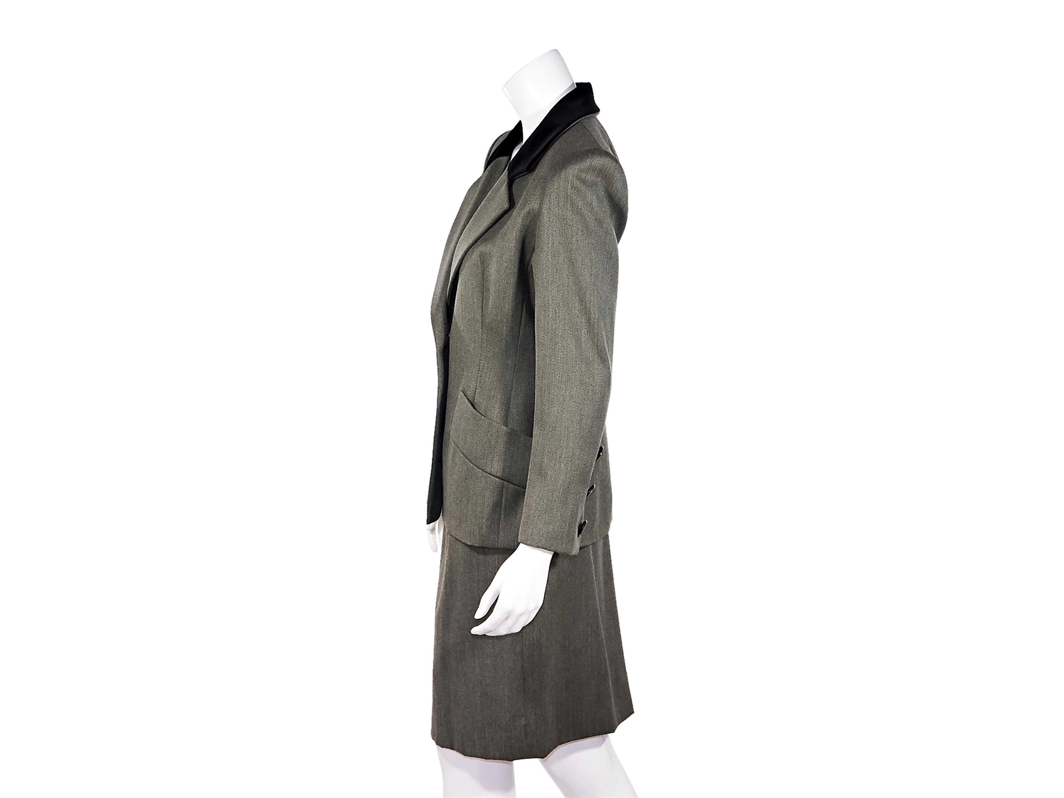Product details:  Vintage grey wool skirt suit set by Givenchy.  Notched lapel.  Long sleeves.  Three-button detail at cuffs.  Button-front closure.  Waist slide pockets.  Matching pencil skirt.  Banded waist.  Jacket:  38