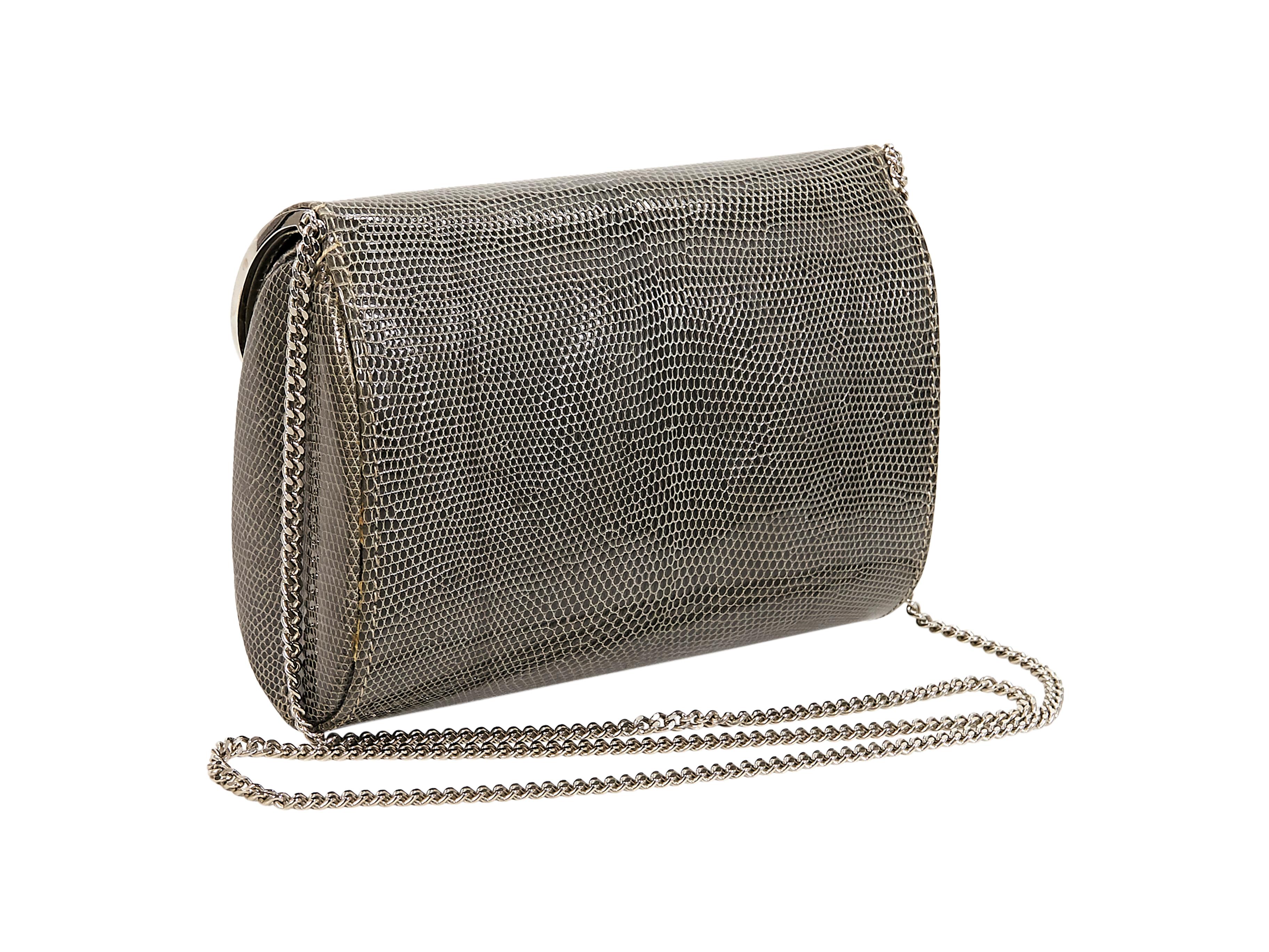Product details:  Vintage grey lizard skin crossbody bag by Gucci.  Circa the 1980s.  Tuck-away chain crossbody strap.  Lined interior with inner slide pocket.  Silvertone hardware.  7