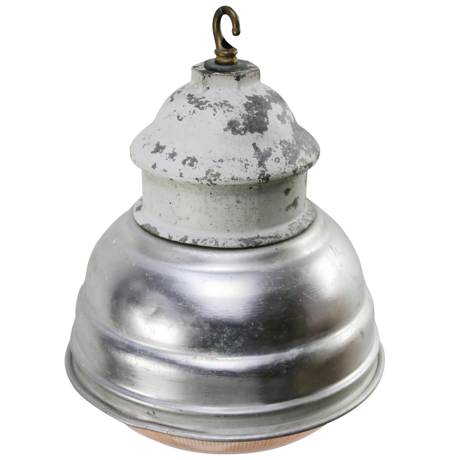 Industrial pendant lamp by Holophane Paris
Grey metal shade with clear striped / holophane glass
Brass top

weight 1.90 kg / 4.2 lb

Priced per individual item. All lamps have been made suitable by international standards for incandescent light