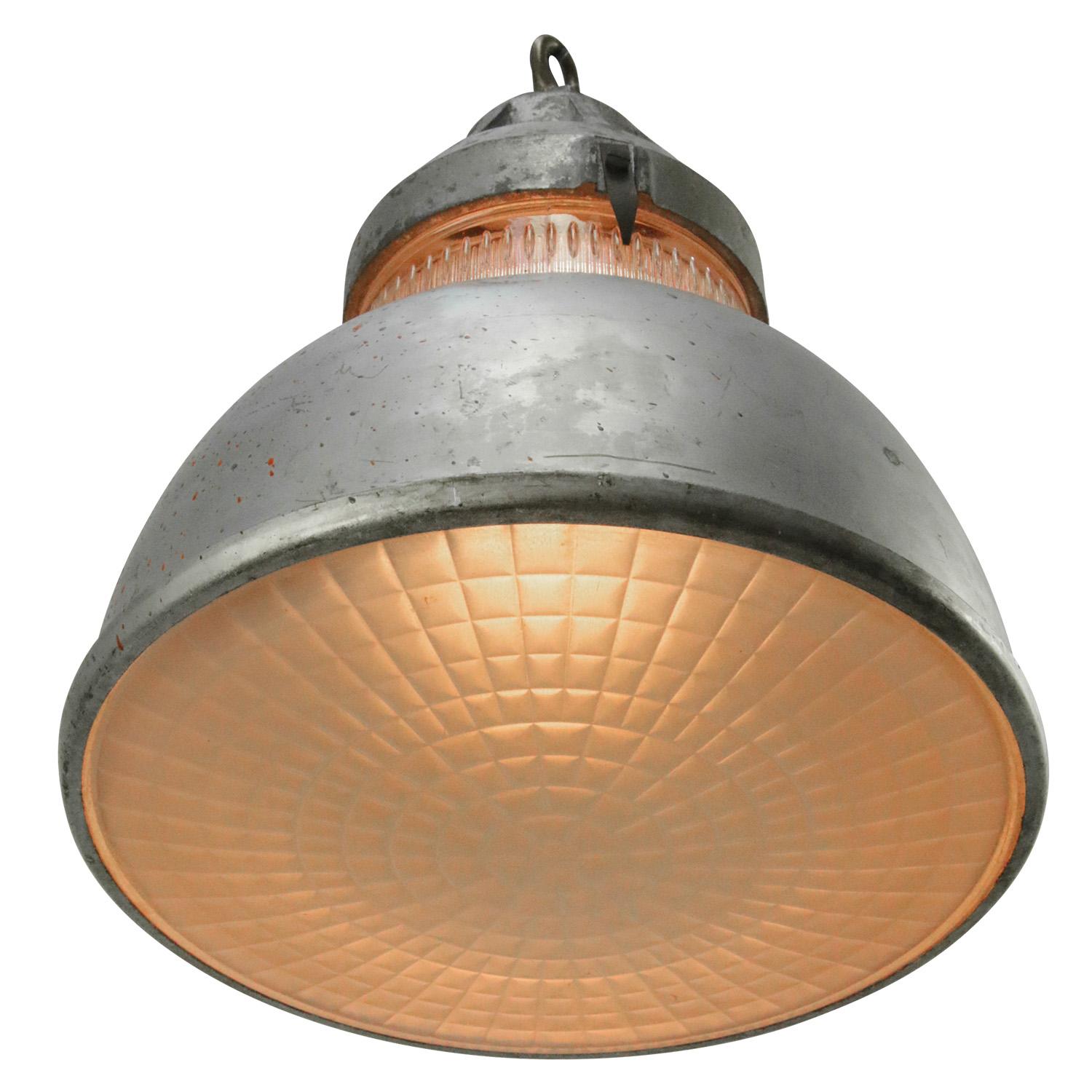 Industrial pendant lamp by Holophane Paris.
Grey metal shade with clear striped / holophane glass.
Brass top.

Measures: weight 4.20 kg / 9.3 lb

Priced per individual item. All lamps have been made suitable by international standards for