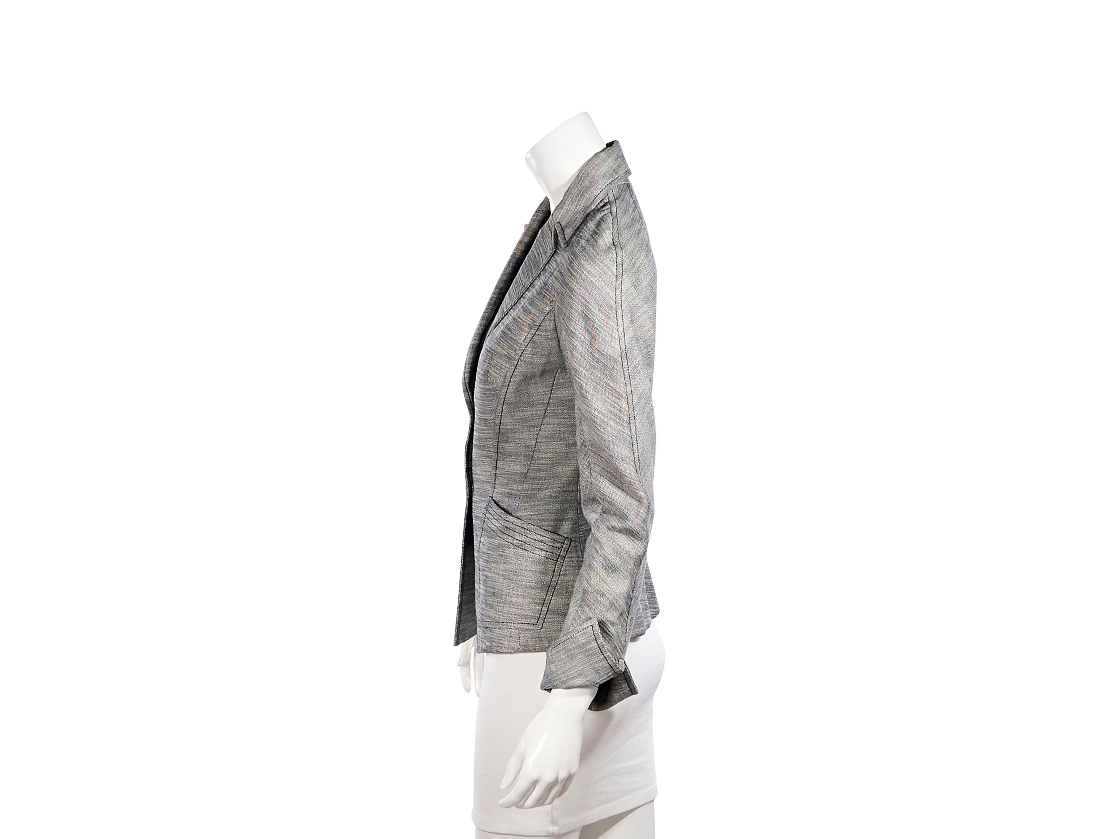 Product details:  Vintage heathered grey cotton blazer by Thierry Mugler Couture.  Peak lapel.  Long sleeves.  Double button-front closure.  Waist patch pockets.  36