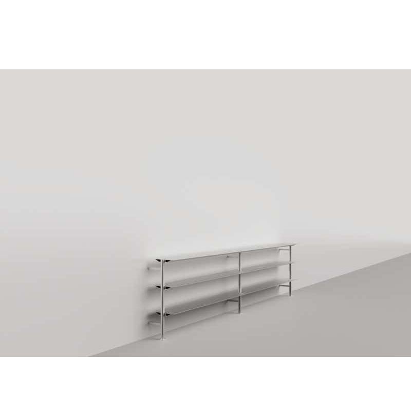 Materials: 
Aluminium

Dimensions: 
D 26 cm x W 300 cm x H 75 cm

The Hypostila shelving was designed in 1979 by Lluis Clotet and Oscar Tusquets to support important amounts of weights on minimum profiles, reaching an infinity of lengths and
