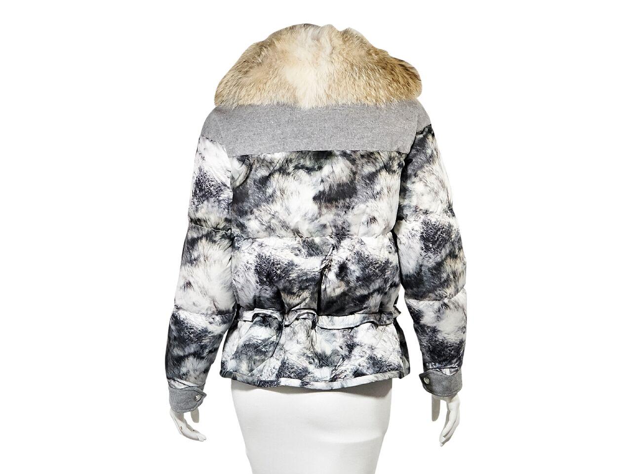 Product details:  Grey and white printed puffer coat by Belstaff.  Accented with jersey details.  Fur collar.  Long sleeves.  Concealed zip-front closure.  Drawstring waist.  Quilted hem.  32