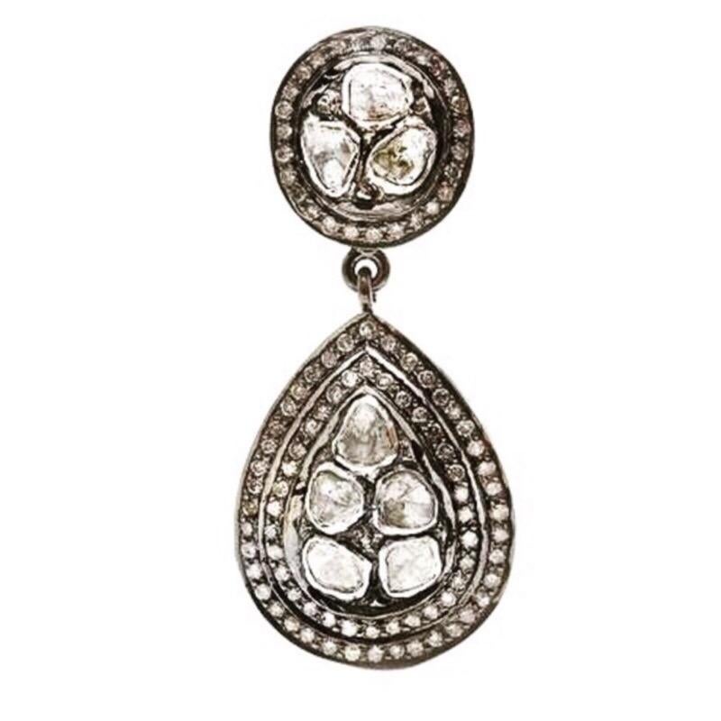 The most spectacular Grey and White Diamond chandelier earrings featuring a melange of contrasting Diamonds set in blackened oxidized Silver with a total Carat weight of 4.60 Carats.

- Grey Diamonds weight approx 2.80 Carats.
- White Diamonds