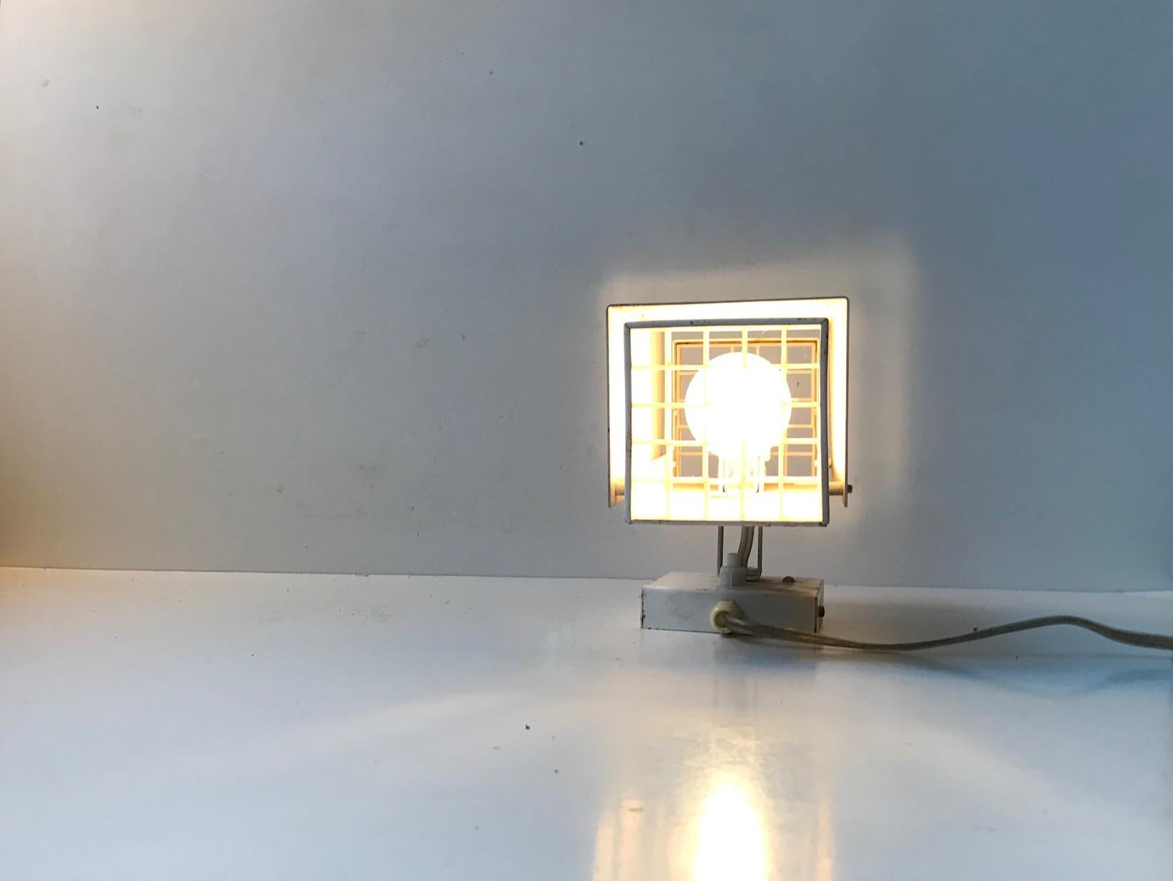 A rare wall light in characteristic color scheme of Preben Dahl: Grey and white. Its made from powder-coated metal and has acrylic light diffusers to the front and backside. Original makers mark sticker still present to the inside of the shade.