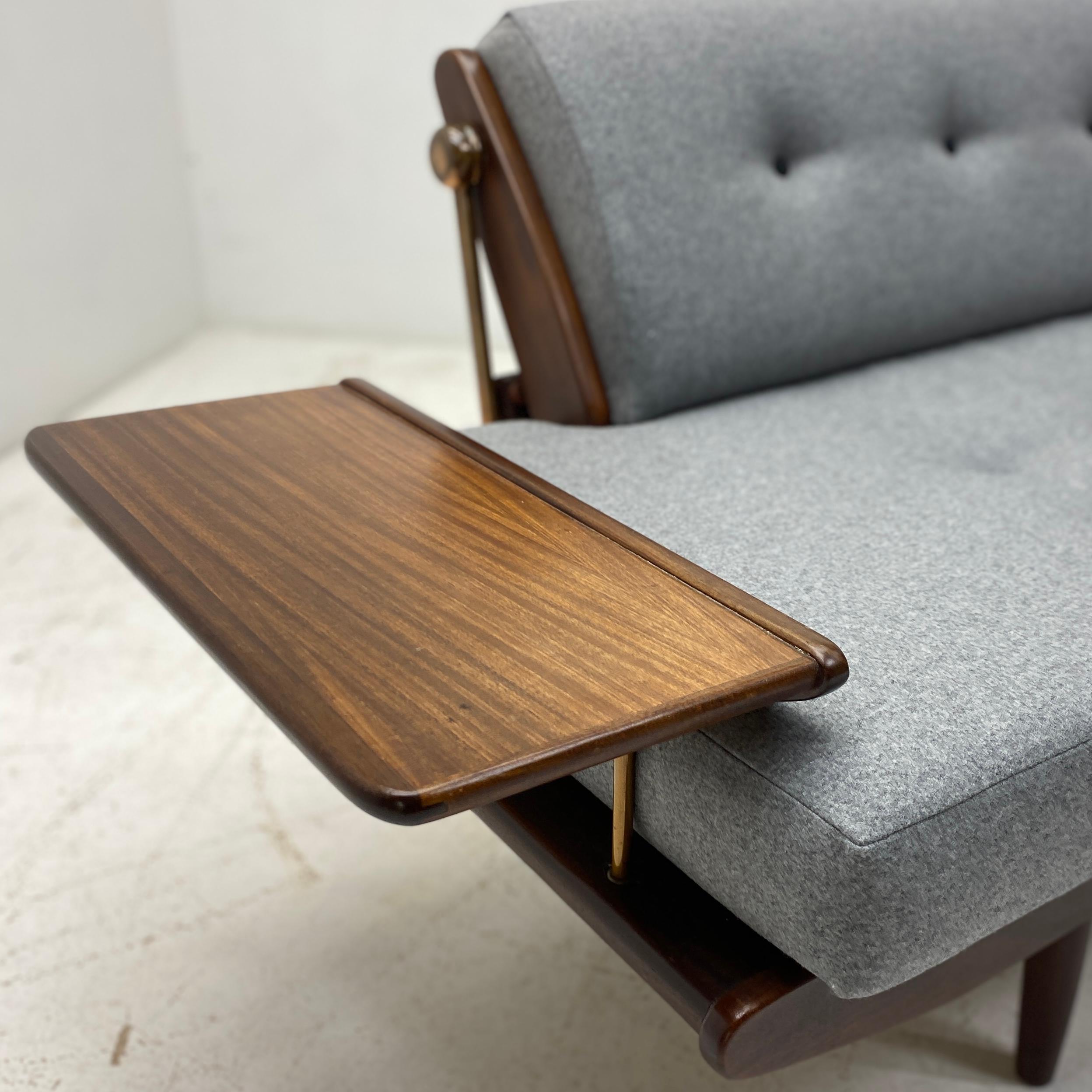 A stunning midcentury British Toothill Wentworth circa 1960. Constructed from teak afromosia & copper fittings. Originally sold through Harrods & Heals, the sofa transforms easily into a daybed with a simple up & over action to the back rest.