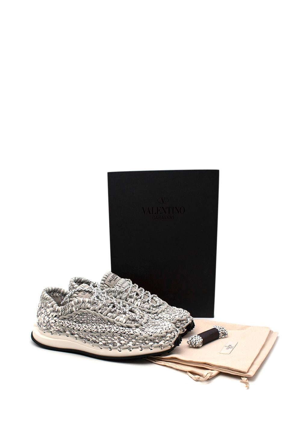 Valentino Grey Woven Cord Sneakers

- Macrame woven uppers in grey marl cord
- Light weight foam and rubber sole 
- Logo branding on the tongue

Materials 
Textile
Rubber

Made in Italy 

33cm Length 
13cm Width 
10cm Height

PLEASE NOTE, THESE