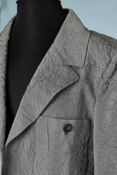 Grey wrinkled edge to edge jacket with branded buttons Chanel