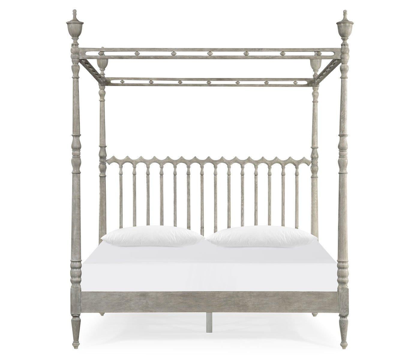 English greyed oak four poster bed with an elegantly carved canopy, with gothic motifs, urn finials and turned and carved posts.

Dimensions: 83.25