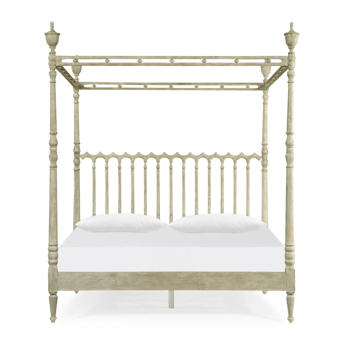 English greyed oak four-poster bed with an elegantly carved canopy, with gothic motifs, urn finials and turned and carved posts.

Dimensions: 67.33