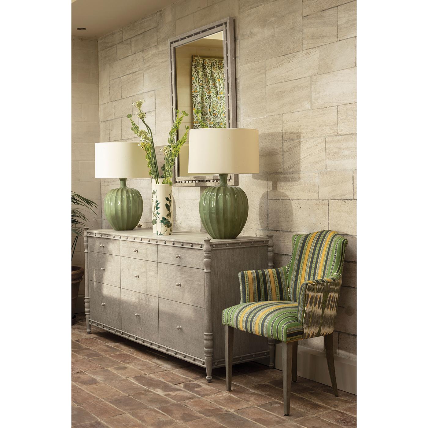 Its greyed oak frame exudes rustic refinement with a contemporary edge. Subtle details enhance its character, making it a striking focal point for entryways, living rooms, or bedrooms.

Designed in a transitional style, it integrates seamlessly with