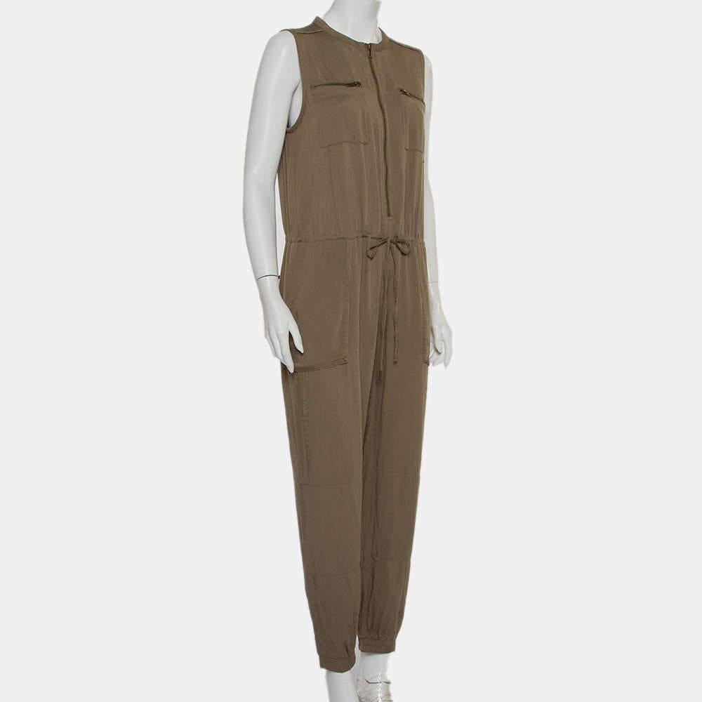 What's not to love about this jumpsuit from Greylin! It comes well-tailored and designed in a sleeveless style. The jumpsuit features tie detail on the front, zip pockets, and a zip fastening. A pair of boots and jacket will complement the jumpsuit