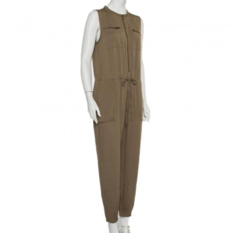 What's not to love about this jumpsuit from Greylin! It comes well-tailored and designed in a sleeveless style. The jumpsuit features tie detail on the front, zip pockets, and a zip fastening. A pair of boots and jacket will complement the jumpsuit