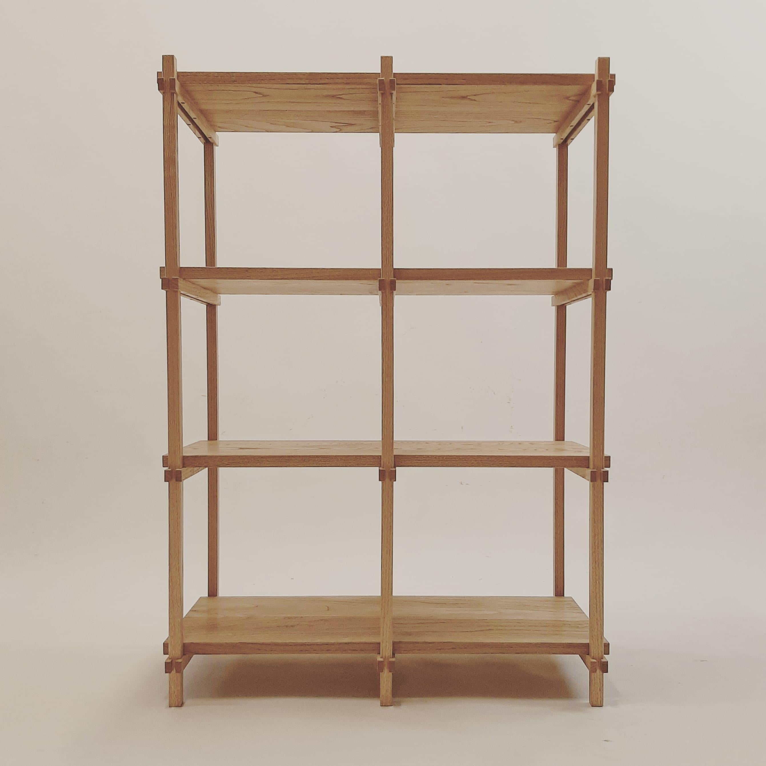 This elegant shelf is crafted from galician chestnut, finished with oil to enhance the natural beauty of the wood. All joinery is meticulously handcrafted, ensuring durability and precision. The grid structure is composed of 20mm thick shelf boards