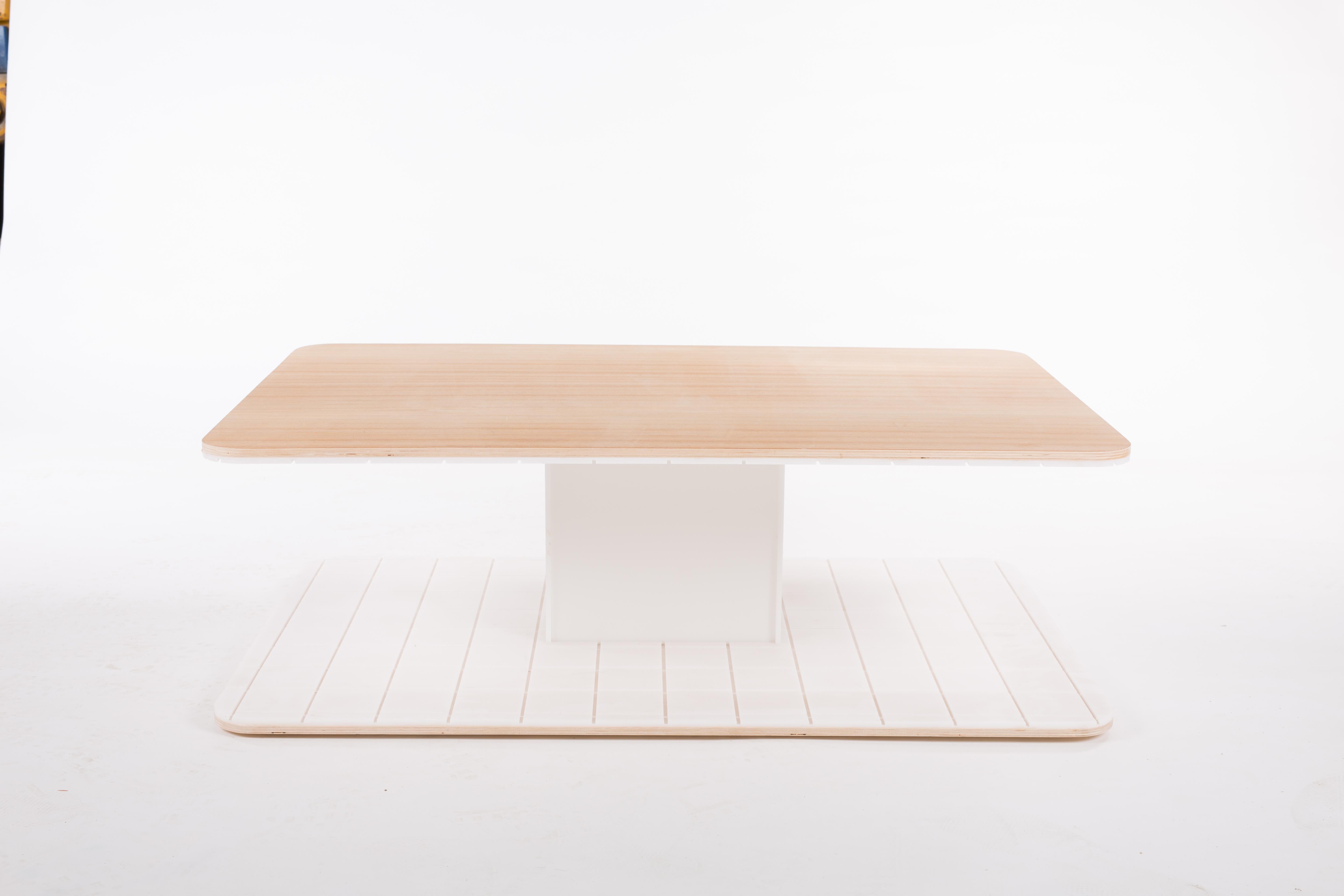 Grid Coffee Table is a playful piece of furniture in the living room. A combination of a clean white grid pattern and 4 color sheets. The coffee table has a useful space to store magazines, books and small tableware. The table top is oiled wood.