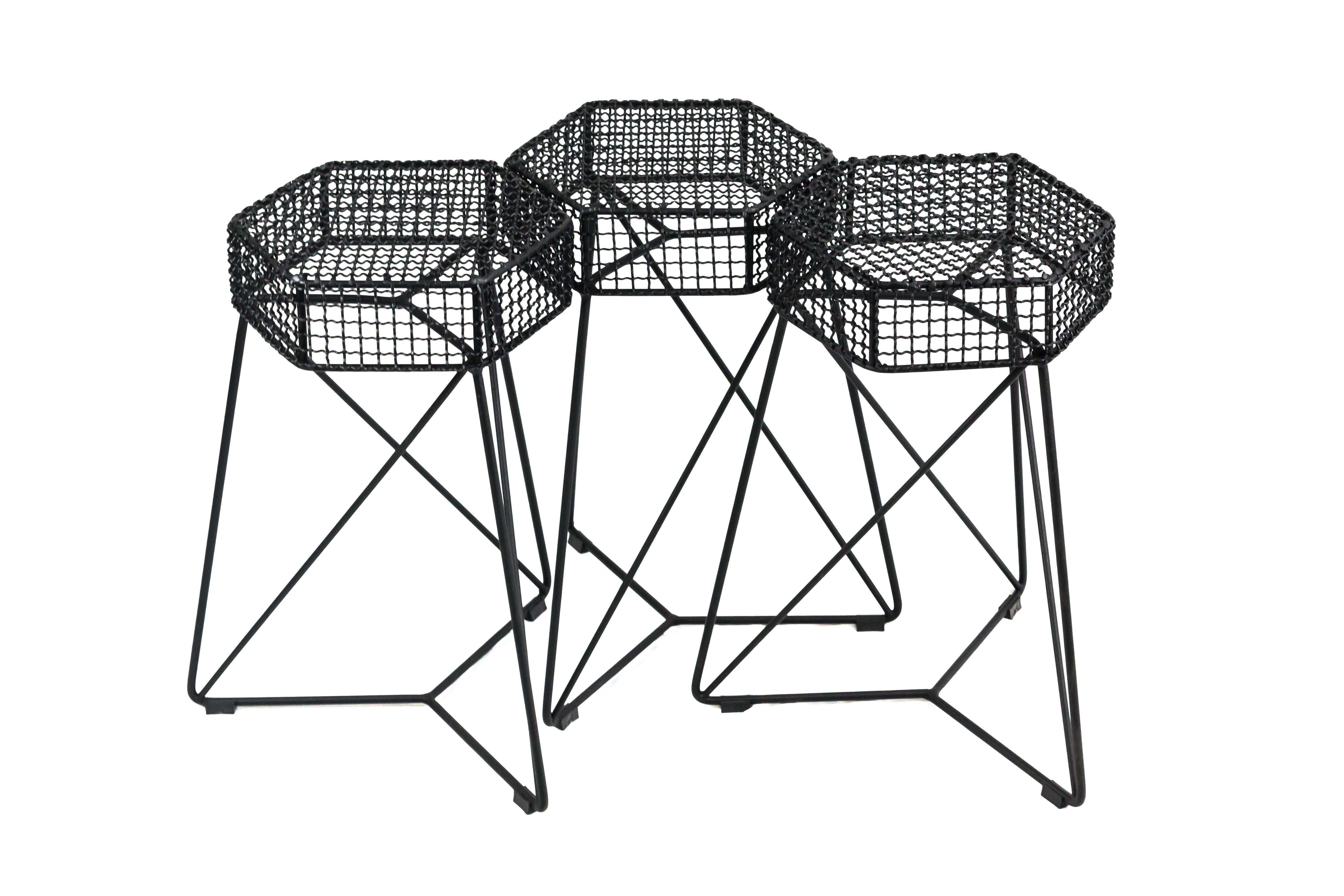 The Grid stool is an use adaptation from an imaginary urban element, where the seat creates a relation between its weight and lightness with the structure. The seat is a grid block and its structure is made of solid iron finished in black