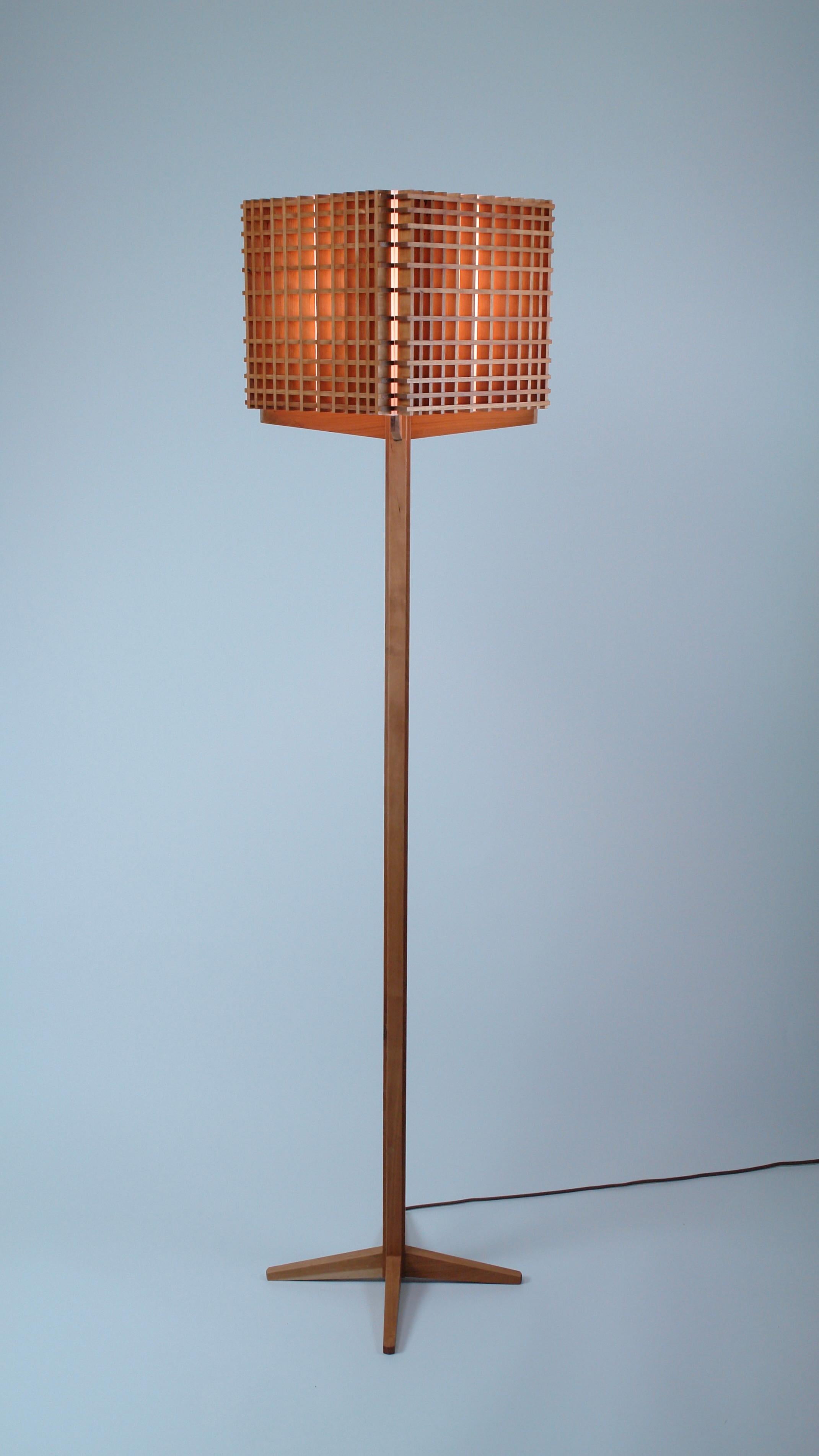 Cherry and Acrylic Grid floor lamp in Scandinavian and Japanese influenced Contemporary style.
The rectilinear forms of the diminishing grid give a paradoxical illusion of circularity, of foreground and background.
Electric components UL listed. LED