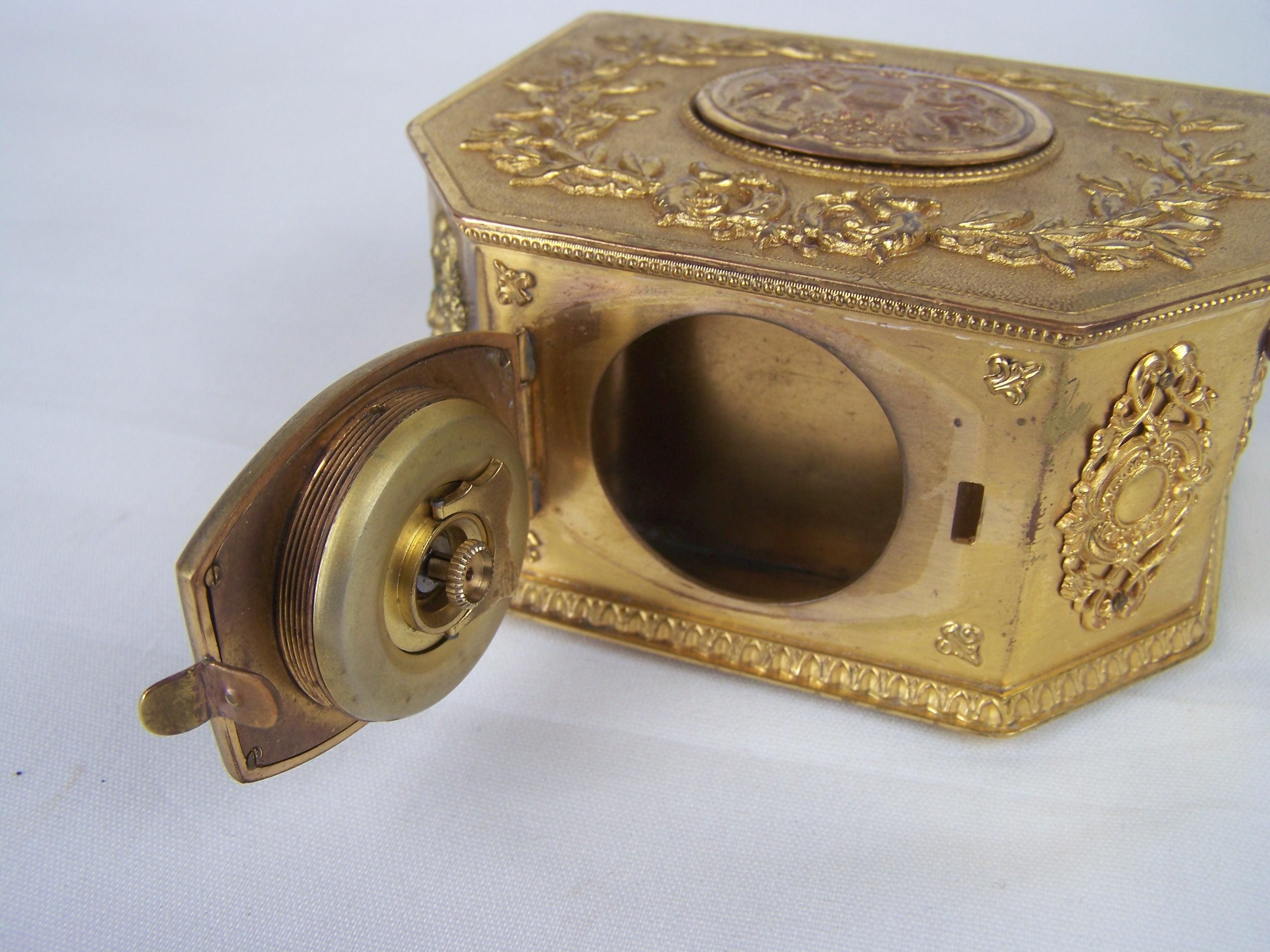 Metal Griebaum singing bird box from the 1950s-60s with clock
