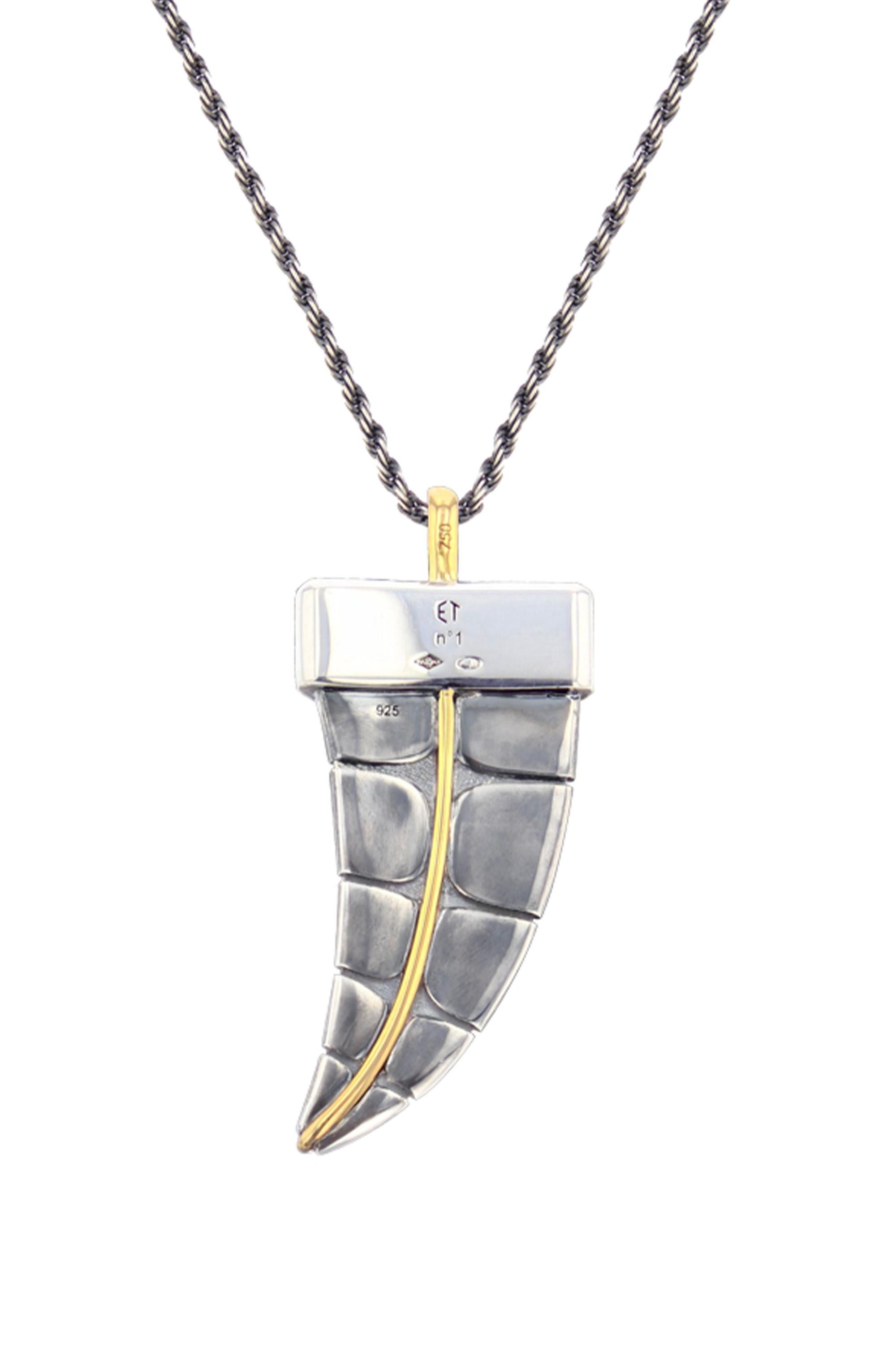 Yellow gold and distressed silver pendant. Distressed silver scales and yellow gold wire.

Details:
18k Yellow Gold: 1.4 g
Distressed Silver: 14 g
Made in France