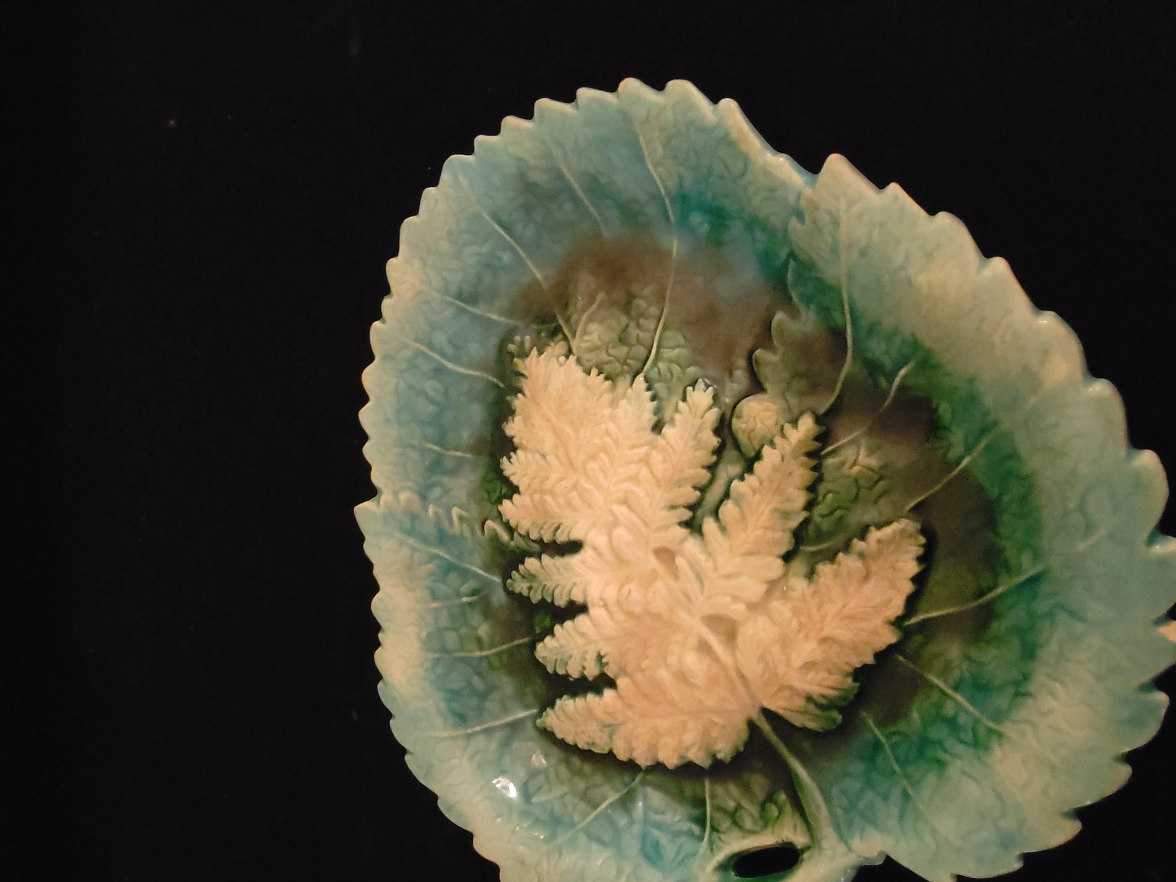 This is a piece of American Majolica, Griffen Smith and Hill, a Pennsylvanian company that specialized in service ware and gift ware. This plate is part of their Etruscan Line. This was a giftware plate. Something colorful rich and very detailed. I