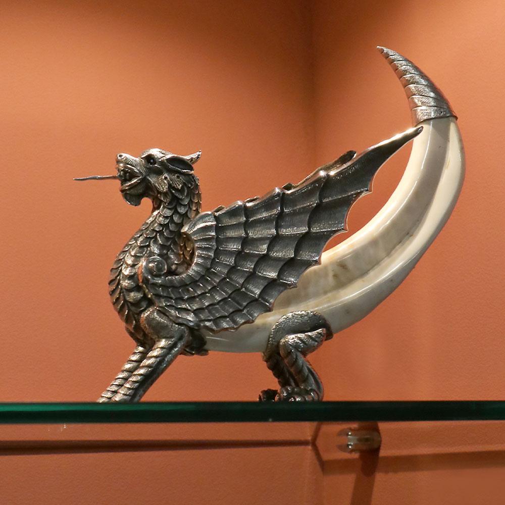 Griffin by Alcino Silversmith 1902 is a handcrafted piece in 925 sterling silver with boar tooth 

The piece is totally handcrafted, hammered and chiseled by excellent craftsmen, giving this piece a much higher future valorization. 

This animal