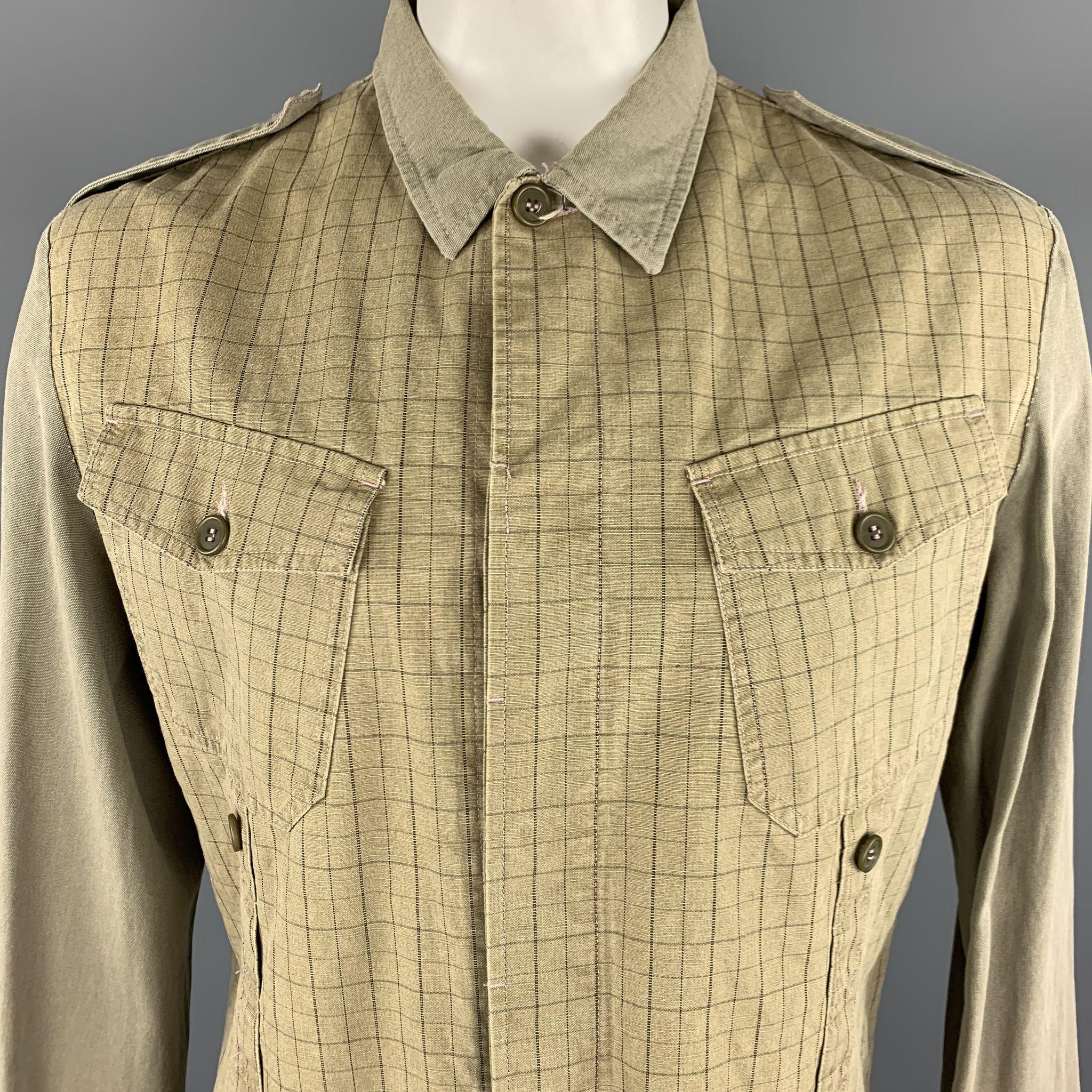 GRIFFIN Jacket comes in khaki tones in a cotton material, mixed fabrics, with epaulettes, patch pockets, hidden buttons at closure, buttoned cuffs, unlined. Made in Italy.
 
Excellent  Pre-Owned Condition.
Marked: XL
 
Measurements:
 
Shoulder: 19