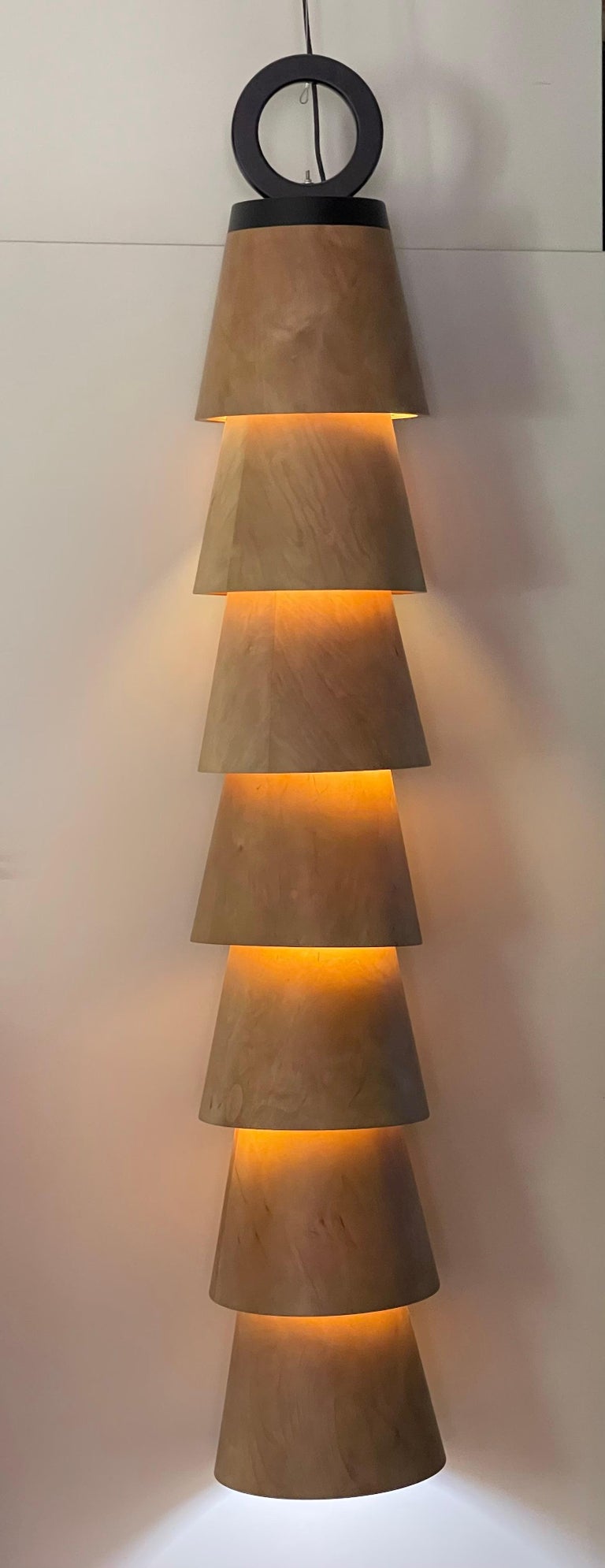 "LOLA" Sculptural Lamp 81" x 13" inch by Grigorii Gorkovenko

MATERIAL: wood
COLOR: nature / black

Lampshade only. 
Wires and lightbulb are not included. 

LOLA lamp:
A module lamp that consists of the lighting cones connected by one pivot
