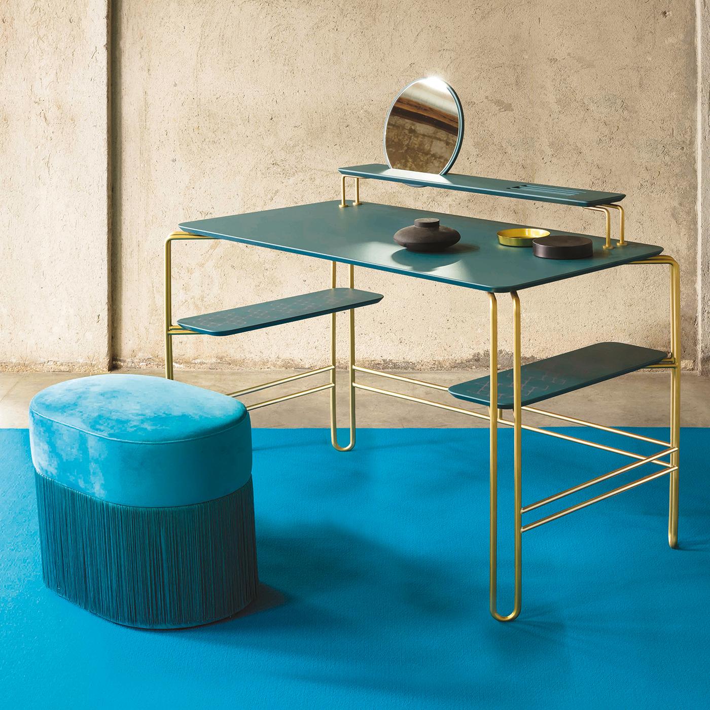 Characterized by clear, simple lines, the Grimilde console desk can be used as a workspace or a Minimalist vanity. On a light metal base with a power coating, the desk's surfaces are made in lacquered MDF, while the two lower shelves, perfect for