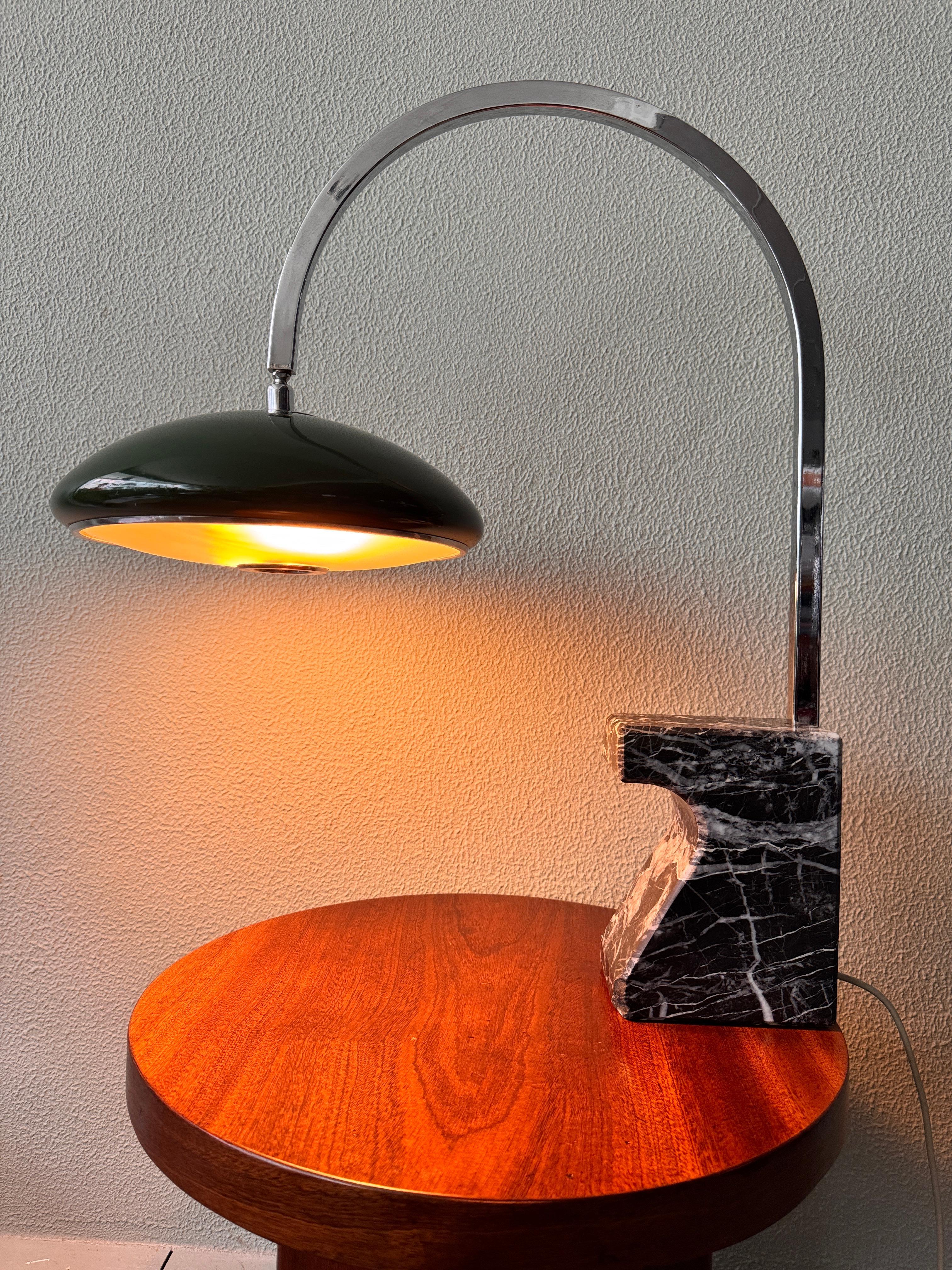 This rare arc table lamp was designed by Luis Pérez de la Oliva for Grin Luz in 1960s Spain, and stands as a prime example of the era’s refined Spanish modernist lighting. The composition combines strong architectural presence with high-quality